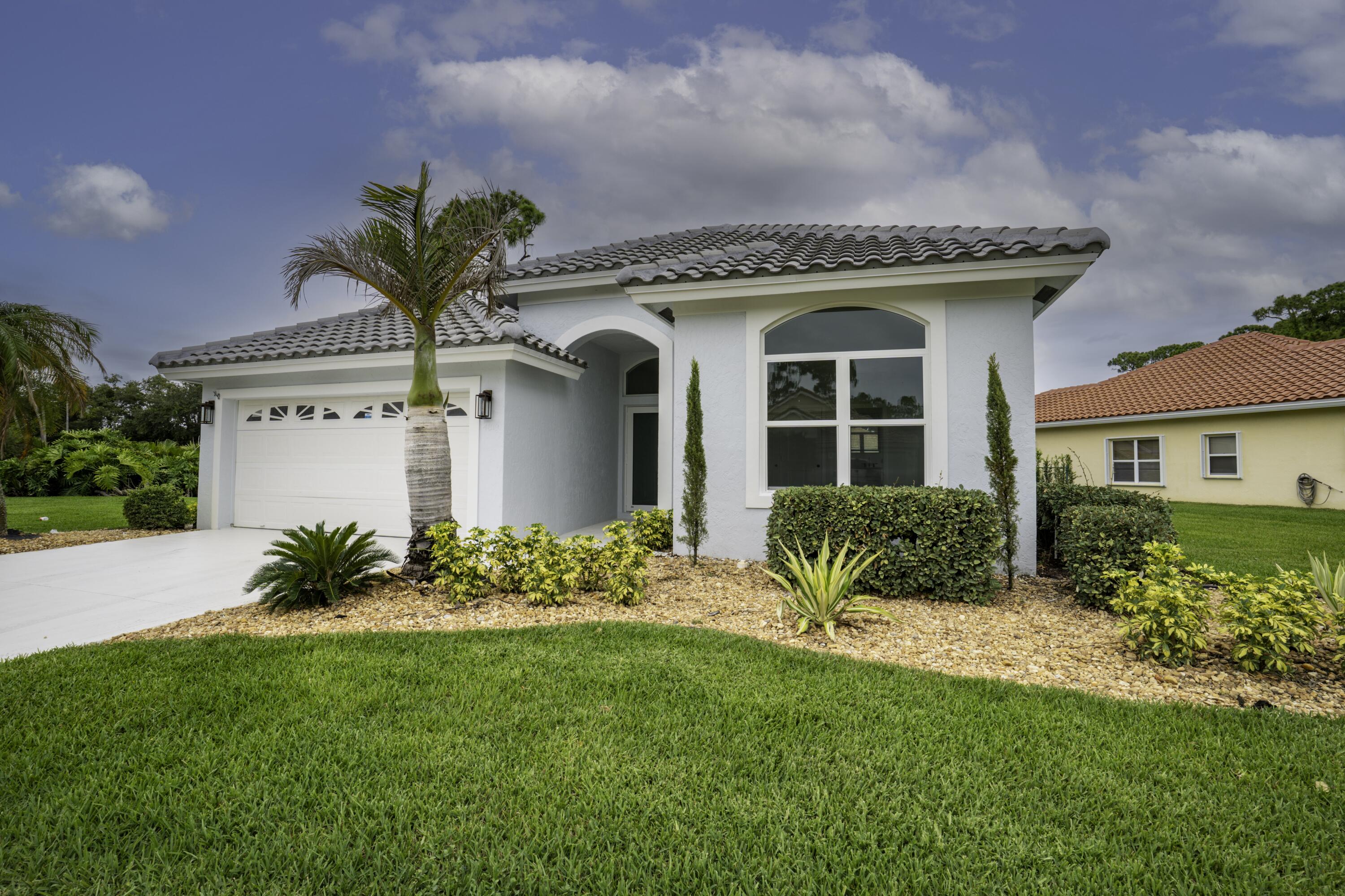 Completely Transformed & Move-In Ready in Desirable Mariner Village! Situated on one of the largest lots in the community, this beautifully renovated home has been reimagined from top to bottom and is truly turnkey. Featuring two spacious primary suites, it's the perfect layout for multi-generational living, or visiting guests. Enjoy peace of mind with a new roof, impact-rated hurricane windows and doors, fresh exterior paint, a newly coated garage floor, new air conditioning system, and updated landscaping. Inside, the modern design shines with vaulted ceilings, brand-new luxury vinyl plank and tile flooring throughout, new insulation and sheetrock, custom built-ins (closets), and two completely renovated bathrooms.  The stunning chef's kitchen is the centerpiece of the home, showcasing new cabinetry, a dramatic waterfall quartz island, full quartz backsplash, and all-new lighting with recessed LED fixtures throughout.  Located on a premium oversized homesite and just steps from community amenities, this home offers the ideal combination of comfort, style, and convenience. Mariner Village residents enjoy easy access to I-95, shopping, dining, medical facilities, and everything the area has to offer.