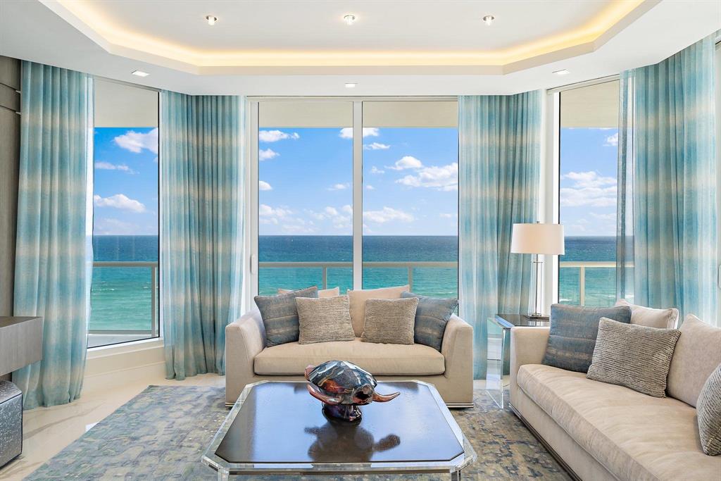 Move in for season!  This is the TURN KEY opportunity you have been waiting for! Located in Vista Blue, one of Singer Island's newest boutique luxury developments, you will love everything about this highly customized exquisite SE corner, direct ocean, 4 bed, 4.5 bath residence & the amenities this property has to offer.   No expense or detail was spared on the interior which was tastefully designed by owner & finished by Steven G Interior design.  Too many upgrades to list... Floating ceilings, custom mill work, closets, lighting & Lutron Solar shades.  Poggenphol custom cabinetry, Miele appliances, 10 foot ceilings.  2 side by side parking spaces near elevator both w/ electrical outlets for electric vehicles.  *All Art excluded from sale* Vista Blue's 5 star Amenities...see more. Unparalleled amenities & detail including gated entry w/security, on-site concierge, elevated pool/spa with ocean views, cabanas, social lounge, clubroom, board room, state of the art fitness center, men's/women's locker rooms w/ sauna, wine bar, wine storage, expansive private beach, air conditioned storage locker.