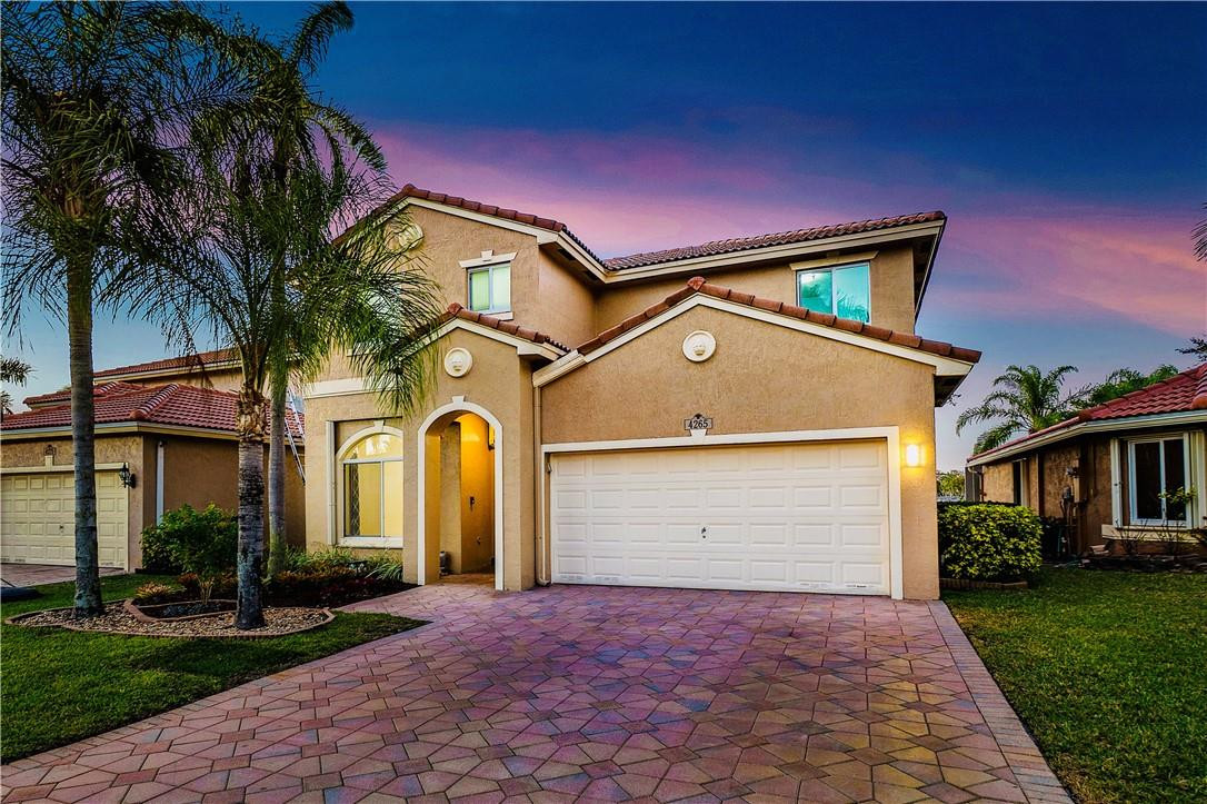 WELCOME HOME!!! ABSOLUTELY STUNNING, RARELY AVAILABLE 4 BEDROOMS, 2.5 BATHROOMS METICULOUSLY MAINTAINED LAKE FRONT HOME IN THE HIGHLY SOUGHT AFTER COMMUNITY BANYAN TRAILS! THIS 2 STORY HOME IS BRIGHT, OPEN & SPACIOUS EXCELLENT FOR LIVING AND ENTERTAINING! RECENTLY RENOVATED KITCHEN, SPACIOUS PRIMARY BEDROOM, WALK-IN CLOSETS, SEPARATE LIVING & FAMILY ROOM, HURRICANE IMPACT WINDOWS & ACCORDION SHUTTERS, STAINLESS STEEL APPLIANCES, GRANITE COUNTERTOPS, NEST THERMOSTAT, SCREENED PATIO WITH A HUGE BACKYARD OVERLOOKING THE GORGEOUS LAKE! EPOXY FLOORING IN THE GARAGE & THE LIST GOES ON! A+ RATED SCHOOLS! WALKING DISTANCE TO PROMENADE & SABAL PINES PARK! LOW HOA INCLUDES CABLE, CLUBHOUSE, 2 POOLS, FITNESS CENTER & PLAYGROUND! CLOSE TO ALL MAJOR HIGHWAYS, RESTAURANTS, SHOPPING & MORE!