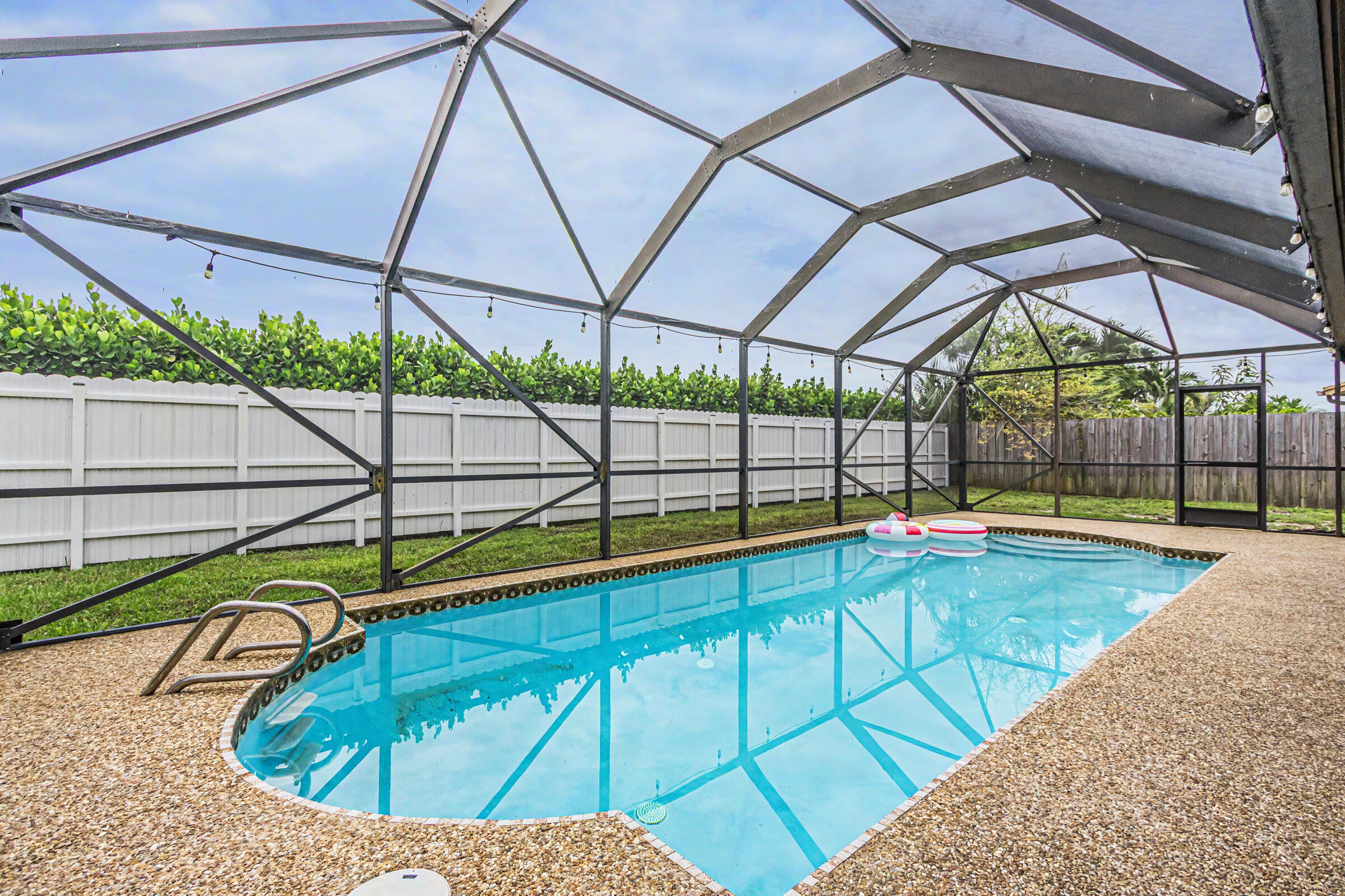 Some homes are updated. This one is upgraded for the way people actually want to live. Set in a quiet, established Margate neighborhood, this fully remodeled home offers a fresh modern design, beautiful finishes, and the kind of comfort that makes you want to move right in. Spend sunny afternoons by the heated saltwater pool, enjoy the confidence of impact windows and a 2023 roof, and appreciate the everyday savings potential of a 13kW solar PV system with battery backup; a rare feature that adds both efficiency and peace of mind. From the tankless water heater to the smart irrigation system that knows when to pause for rain, every detail has been chosen to make life easier, cleaner, and more enjoyable. This is not just move-in ready, it is future-ready. This is the kind of home that makes moving feel easy. Tucked into a quiet, well-established neighborhood, this fully remodeled residence blends fresh modern design with the upgrades buyers actually want but rarely find all in one place. Inside, clean current finishes create a bright, move-in-ready feel, while outside the heated saltwater pool sets the stage for relaxed Florida living year-round. The 13kW solar PV system is designed to help keep electric costs exceptionally low, and the added battery backup provides an extra level of comfort and peace of mind. With a 2023 roof, impact windows, tankless water heater, and smart irrigation with rain-sensing geofencing, this home delivers style, efficiency, and confidence from day one. Beautifully updated, thoughtfully equipped, and ready to enjoy.