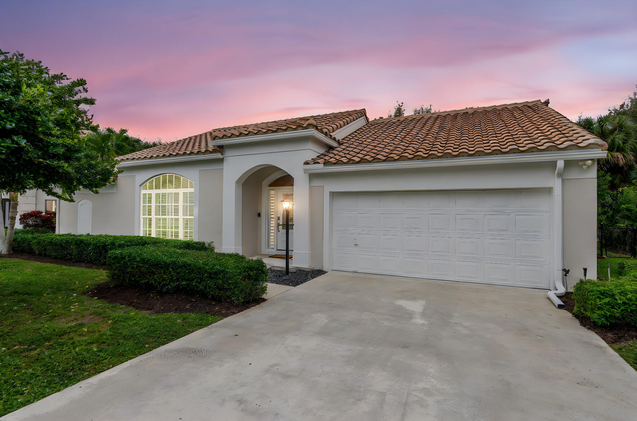 Welcome to this beautifully upgraded 4-bedroom, 2-bath CBS pool home featuring recently installed top-of-the-line impact glass windows, located in the highly desirable Hunt Club of Palm Beach Gardens. Fully renovated in 2021 and set on an oversized lot, this residence is thoughtfully designed for effortless Florida living. Inside, soaring vaulted ceilings anchor the spacious living room, enhancing natural light and creating an airy, open feel that flows seamlessly throughout the home with cohesive flooring underfoot. The designer kitchen serves as the heart of the home, showcasing quartz countertops, natural gas, high-end finishes, and newer appliances including a 2025 GE Profile refrigerator and dishwasher. The primary suite is generously sized, while both bathrooms offer a spa-inspired aesthetic with quartz countertops and a clean, modern design. Additional interior upgrades include a new electrical panel and custom, professionally designed closet systems. Step outside to a private, fully fenced backyard where a refreshed saltwater pool sets the stage for both entertaining and relaxation. Recent improvements include a new pool pump and saltwater conversion in 2025, a newly sealed pool deck in 2026, and fresh exterior paint completed in 2025. Major systems have been thoughtfully updated with a new A/C system in 2022 and a gas hot water heater installed in 2023. Centrally located just minutes from premier golf courses, shopping, dining, and beautiful beaches, this home offers both comfort and convenience. The Hunt Club community HOA enhances the lifestyle with cable, internet, playground, garbage service, and maintenance of common areas providing truly low-maintenance living. Make this luxurious retreat your own and experience refined living in this exceptional residence.