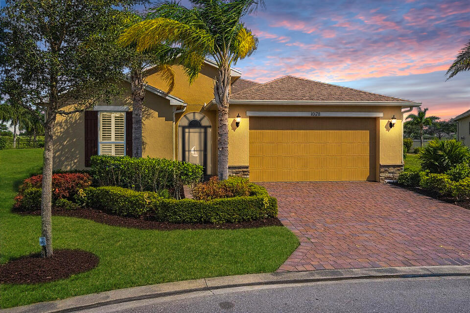 Welcome to effortless Florida living in Vitalia, a premier 55+ gated community. This beautifully appointed 2-bedroom home with den/flex room sits on an oversized, private lot and features a whole-house solar system (paid in full!) plus impact glass windows for peace of mind. The open floor plan showcases tile and wood flooring, plantation shutters throughout.  The chef's kitchen boasts granite counters, 42'' wood cabinetry, and stainless steel appliances. The spacious primary suite offers spa like bathroom with dual sinks and a walk-in shower. NEW 2026 garage door installed! Relax on the oversized screened lanai or enjoy resort-style amenities including a pool, pickleball, fitness center, clubs, and more. Schedule your showing today!
