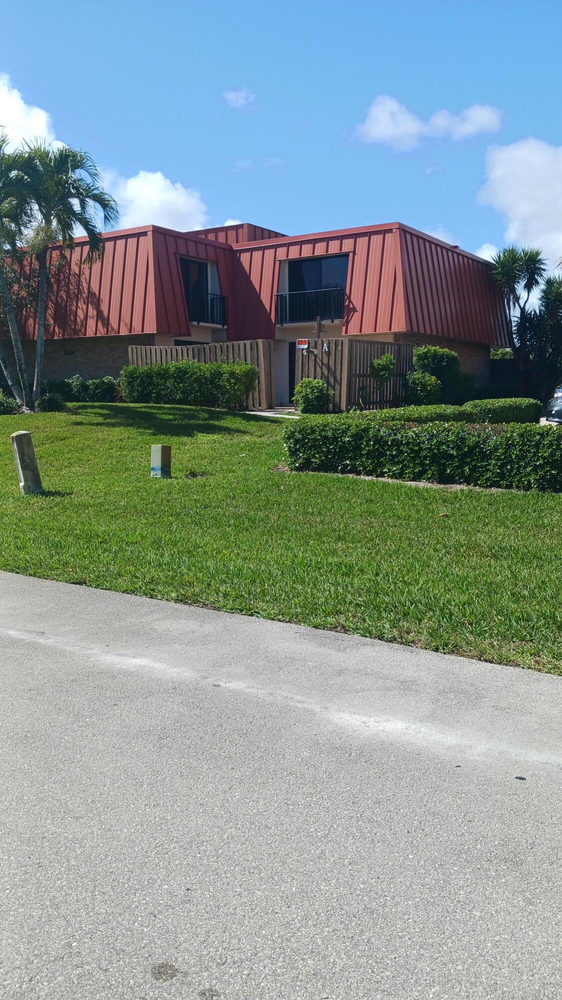 BEST DEAL, This two-story townhouse located in central Palm Beach Gardens ,1 mile to P B G mall.Pubix,gym 1 minute away.Spacious bedrooms, all tile upstairs and down, all new stainless steel appliances,gas waterheater 5 months old, upgraded kitchen cabinets, quartz stone countertops and backsplash, faucets & sinks throughout. Both bathrooms with luxury tile with lighted neon mirrors.lighted wall unit in living room has gas  fireplace with seperate thermostate.Private courtyard 6ft fence all new, paint throughout inside Also basic cable included with HOA along with Inside &. Outside of structure hurricane insurance.