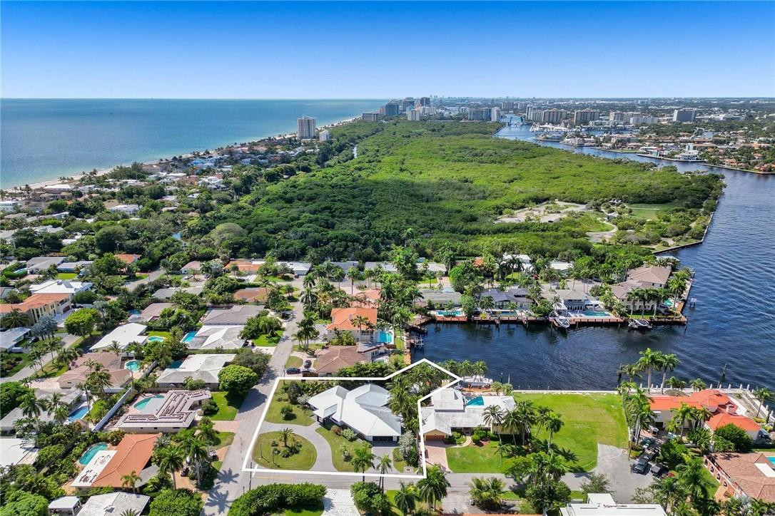 Spectacular beach area deep waterfront residence that pairs South Florida's quintessential outdoor lifestyle w/ high-end interior custom finishes. Situated on an oversized 15,541 sq ft lot & perfectly positioned to maximize the extra wide canal & Intracoastal views. Superior craftsmanship is evident w/every detail of this residence completely renovated & redesigned down to the studs. Work completed in 2019 leaving behind an almost new construction, modern home w/all the bells & whistles! Amazing gourmet kitchen offers cool quartz counters w/ island, custom modern cabinetry, Sub-Zero & Wolf appliances. European-style custom interior doors & hardware, Imported Porcelain 67X16 tiles throughout. Tropical resort-like setting w/heated pool & electric lifts for your boat & jet Ski. Bayview school
