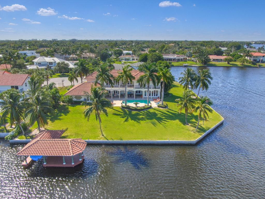 Delray Beach estate with 325 feet of waterfront on a 1/2 acre point lot on Lake Eden. Wide open water views from all the primary rooms. 6 bedrooms, 5 full baths, 2 half baths, living/family rooms on two levels, a private office, and an expansive primary bedroom with French doors leading to the pool and waterfront. Hurricane Impact glass and impact French doors are throughout the house. All air conditioning units are brand new. Boathouse with electric boat lift. Heated pool with hot tub spa. Large loggia with ample dining and entertaining areas. Multiple outdoor balconies overlooking Lake Eden. Over-sized 3 1/2 car garage. Prime location just minutes from Delray's pristine beach and fine dining on Atlantic Avenue. Live the Floridian dream lifestyle on the waterfront in Delray Beach. Hurricane proof glass is everywhere providing endless natural lighting throughout the home. The primary suite is located downstairs and four bedrooms are upstairs. 315 Lake Eden is located on a secluded, almost private cul de sac. The substantial 1/2-acre property includes a large pool, spa, boat house, boat lift, and lots of lushly landscaped yard. Lakes Ida and Eden offer powerboating for watersports, fishing and wave runners. 
Breathtaking views the peaceful serenity of the water emanate from practically every room. Gorgeous cherry wood floors flow throughout the house. Several sets of hurricane proof doors span across both floors of the lakeside of the house. Outside is a covered patio for entertaining and outdoor dining along with a massive pool and spa. For boaters, there is a boathouse on pilings with an electronic boat lift. 

Delray Beach, Florida is one of the most sought-after cities in the United States. The Lake Ida neighborhood specifically is one of the hottest areas because of its proximity to Delray's downtown Atlantic Avenue, its pristine, sandy beach and gleaming, wavy ocean. The prime location combines with its spacious lot sizes typically ranging from 1/4 to 1/2 acre. A short 2-mile drive gets you to Delray's pristine sandy beach and bright blue ocean wavy waters and to the spectacular restaurants and nightlife of Atlantic Avenue aka Downtown Delray Beach. Delray features 5-star hotels including the Opal Grand, the Seagate and the Ray. Plus, there are dozens of amazing eateries. 

The Lake Ida neighborhood is ideal for families. A half dozen top ranked private schools are within minutes by car, golf cart, bicycle or walk. You get the best of all lifestyles. Your family will thrive at 315 Lake Eden Way. This Lake Eden waterfront estate in Delray Beach's most prime family neighborhood truly offers the most complete, amazing and happy lifestyle. A rare opportunity to have it all on the waterfront. Upscale Floridian lifestyle at 315 Lake Eden Way in Delray Beach, Florida!