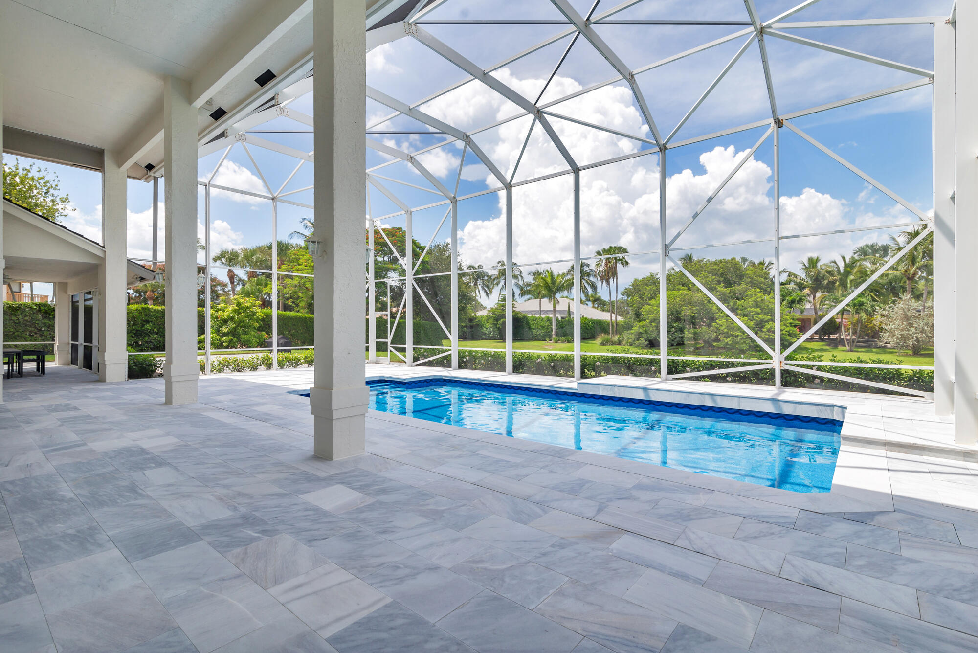MASSIVE PRICE IMPROVEMENT! PLENTY OF ROOM FOR A HANGAR! BEAUTIFUL 4 BED 3 BATH + Office DIRECT TAXI-WAY HOME! An exceptional opportunity to purchase a wonderful house in the highly sought-after aeronautical community of Aero Club. Enjoy the space & privacy from your enormous backyard with an oversized enclosed patio, heated salt pool, outside shower and access to a full cabana bathroom. This home features:  - New Smart Home System Throughout - New Pool Liner - New Pella Front Door  - New Hurricane Rated Garage Doors - New pavers leading up to front door, side of house and backyard patio (MARBLE) - Speakers outside and inside home - Tankless Hot Water system - New AC (3) - New carpeting on 2nd floor There is plenty of room for a hangar. The Wellington Aero Club offers a 4,000ft paved, lighted runway, personal tie down space included in low HOA, Pilot House, small jets allowed! This home offers a one-of-a-kind lifestyle taxi up to your back door. Ideally located close to WEF and NPC. Bring your buyers!