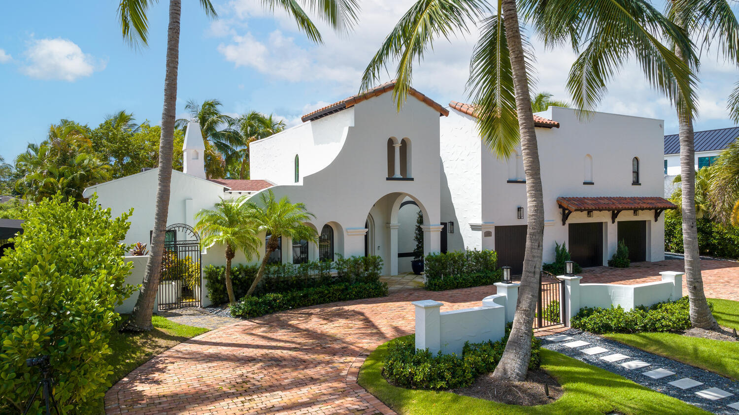 A modern take on a Mediterranean Villa Estate on West Palm Beach's best street in the heart of the SoSo!  Almost 7,000 square feet of designer inspired indoor and outdoor living spaces on a large double 100x130 lot. The main residence offers 4,500 sqft of newly renovated space, custom millwork, 4 bedrooms, 3.5 bathrooms, and a large, finished 3 car air-conditioned garage. The generous living areas are highlighted by Lutron lighting features throughout the home and a gas fireplace in the salon.  The formal dining room contains a floor to ceiling wine display case as well as a separate wine fridge.  Large gourmet chefs kitchen includes luxury appliances and fixtures and leads to family room with custom built-ins, ideal for a home theater setup. A spacious loggia off the kitchen is perfect for entertaining with a summer kitchen and hide away electric screens. A 2 story guest cottage features an expansive living room with wet bar, poolside bedroom with full bathroom, and second floor studio apartment with full bathroom accessed by a separate entrance. An incredible estate property in the hottest neighborhood in West Palm Beach!