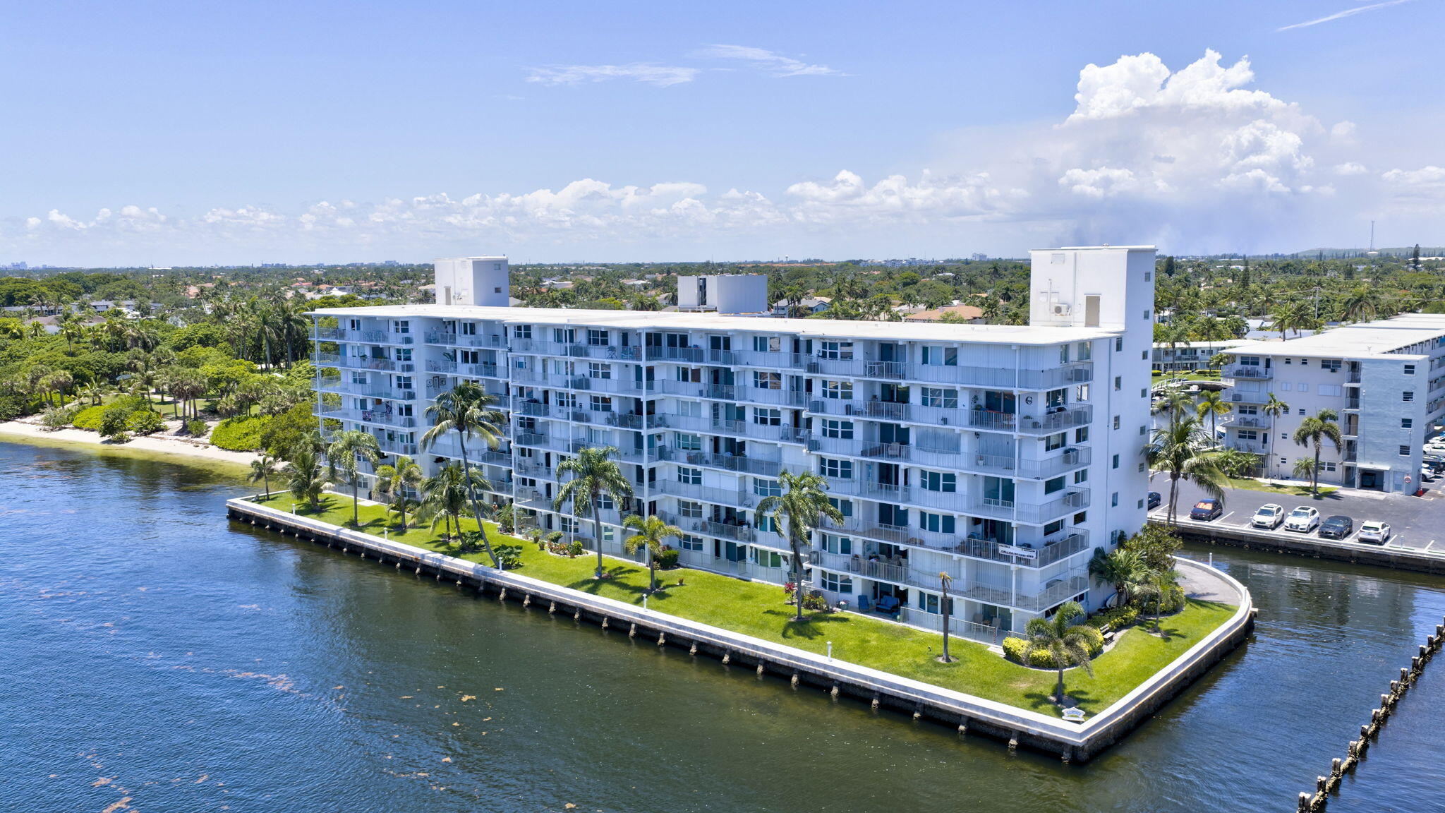Wake up to panoramic Intracoastal and ocean views from this exquisitely renovated top-floor penthouse, where every detail has been thoughtfully designed for elegant waterfront living. Perfectly positioned in one of the community's most peaceful locations, this exceptional 1-bedroom, 1-bath residence sits at the end of a quiet street adjacent to a park, offering remarkable privacy with virtually no traffic noise.  Inside, sophisticated marble-look porcelain tile flows seamlessly throughout, complemented by hurricane-impact windows and doors that frame spectacular water views while providing peace of mind. The expansive east-facing balcony is the perfect place to enjoy breathtaking sunrises over the water, while the beautifully renovated kitchen captures picturesque western views of the marina and resort-style pool. Featuring granite countertops, stainless steel appliances, a pantry, and abundant cabinetry, the kitchen is as functional as it is stylish.  The spacious primary suite offers a generous walk-in closet, creating a true retreat. Set directly on the Intracoastal Waterway, this sought-after waterfront community features its own private marina, providing an unmatched coastal lifestyle.  Enjoy complete confidence knowing all major building improvements have been completed and fully paid by the seller, including concrete restoration, a brand-new seawall, 2024 roof, underground plumbing replacement, generator,  exterior painting, and more. Simply move in and embrace effortless luxury with stunning views, exceptional quality, and worry-free ownership.