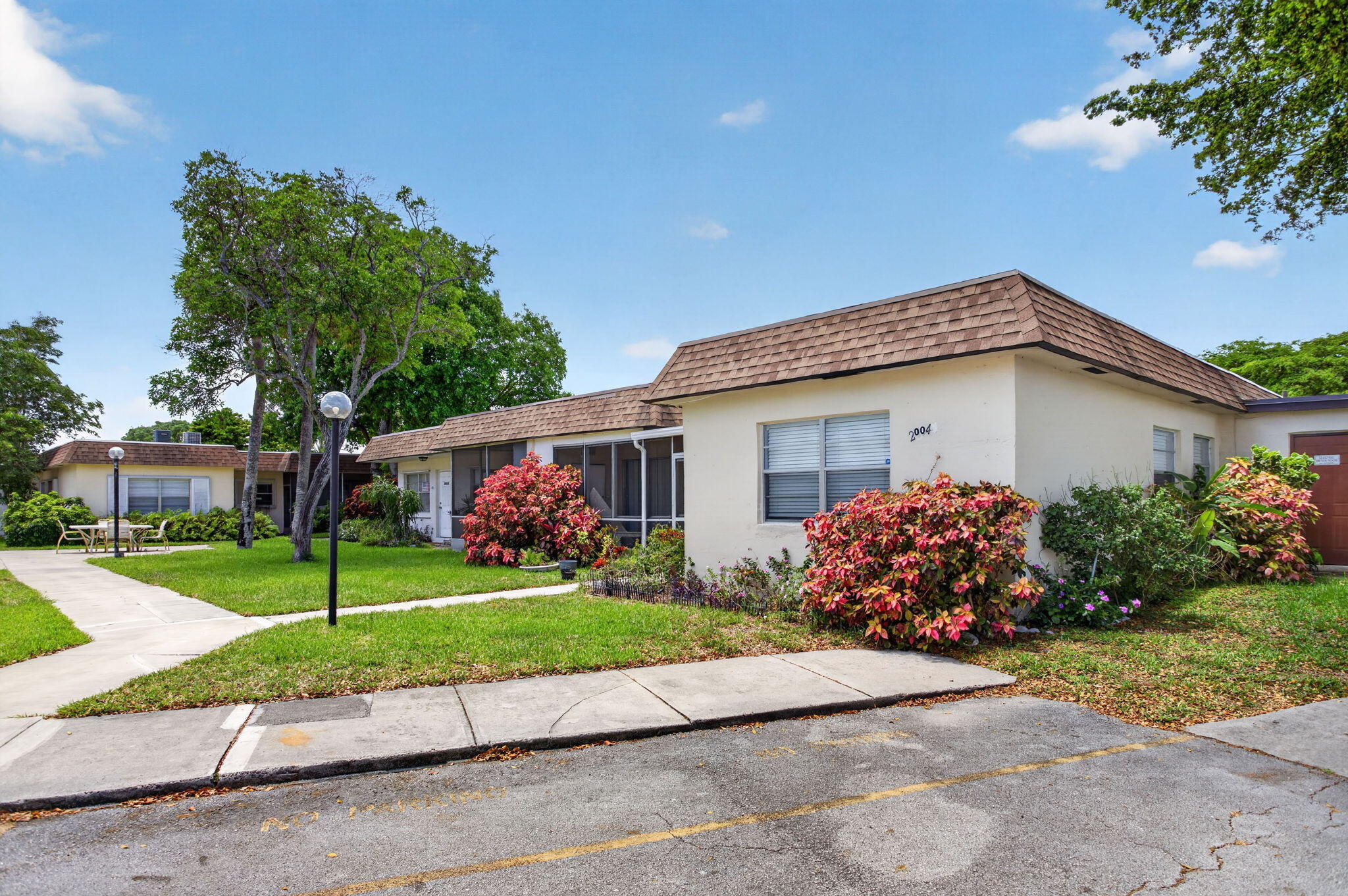 Charming 2-bedroom, 2-bathroom villa located in peaceful 55+ community of Natura in Deerfield Beach. This well-maintained unit features a spacious living area, updated kitchen, and a screened porch, perfect for enjoying the Florida breeze. The community offers fantastic amenities, including a pool, clubhouse, and more. With easy access to I-95, shopping, dining, and beautiful beaches are just minutes away. Enjoy the convenience and comfort of living in this vibrant, age-restricted community. Don't miss this opportunity to call it home! Has an association and approval is required.