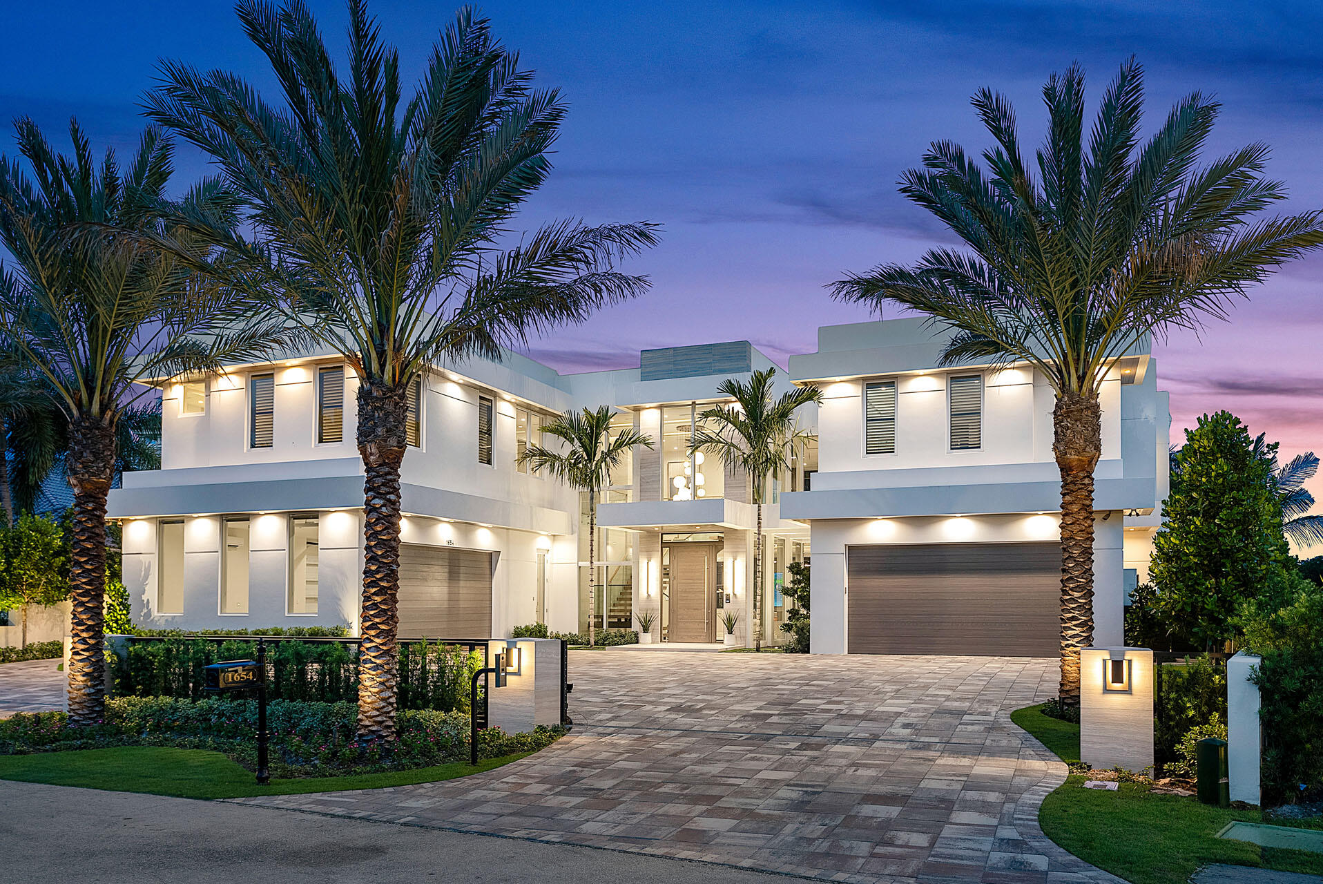 Welcome home to 1654 Sabal Palm Drive, a brand new extraordinary masterpiece crafted by SRD Building Corp. and furnished by the renown P&H Interiors. This prestigious Signature Estate takes golf course luxury living to new heights, commanding 132 feet frontage of stunning views of multiple fairways and the 13th green in the esteemed Royal Palm Yacht & Country Club. Embrace the grandeur of this turn-key home, encompassing over 8,800 sf of sheer living splendor. The 6 lavish bedrooms offer abundant space to accommodate family and guests. A trendy club room awaits, complete with a striking bar and wine room, setting the stage for unforgettable gatherings, and a dedicated study and multiple living rooms add sophistication and versatility to this impressive abode. Indulge your culinary passions in the gorgeous open-air kitchen, where culinary delights meet exquisite design. Enjoy cutting-edge technology with the innovative Crestron system, which offers comprehensive control over lighting, AV systems, music, security cameras, electronic window treatments, and more!
 
The resort-style backyard beckons as an incredible South Florida retreat, featuring a custom zero-edge pool and spa with a mesmerizing fire features.  The pool is wrapped by a large covered loggia with a summer kitchen and fully retractable screen enclosure, further elevating the outdoor entertainment. Welcome to the epitome of modern elegance, where every detail aims to provide the ultimate luxurious golf course living experience. Buyer to pay documentary stamp taxes on the deed and title insurance.