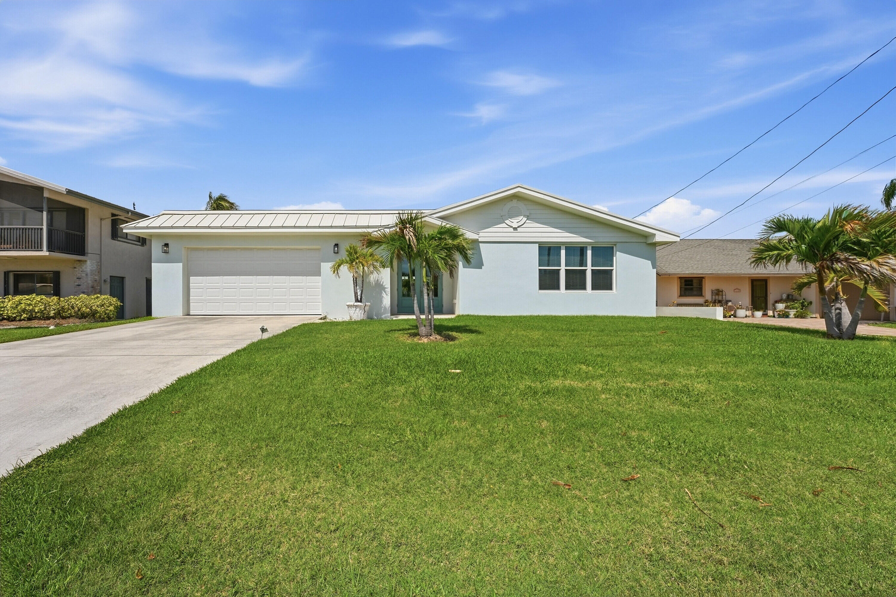 Coastal living at its finest! This beautifully remodeled home on South Hutchinson Island is just three blocks from the pristine Atlantic shoreline. Located in the sought-after South Beach area, you're steps from vibrant restaurants and the famous weekly Farmer's Market.No detail has been overlooked in this move-in-ready retreat. The open layout is anchored by a stunning kitchen with quartz countertops and sleek ceramic flooring throughout. Experience the best of St. Lucie County's relaxed island lifestyle—where the ocean breeze and world-class fishing are right at your doorstep.