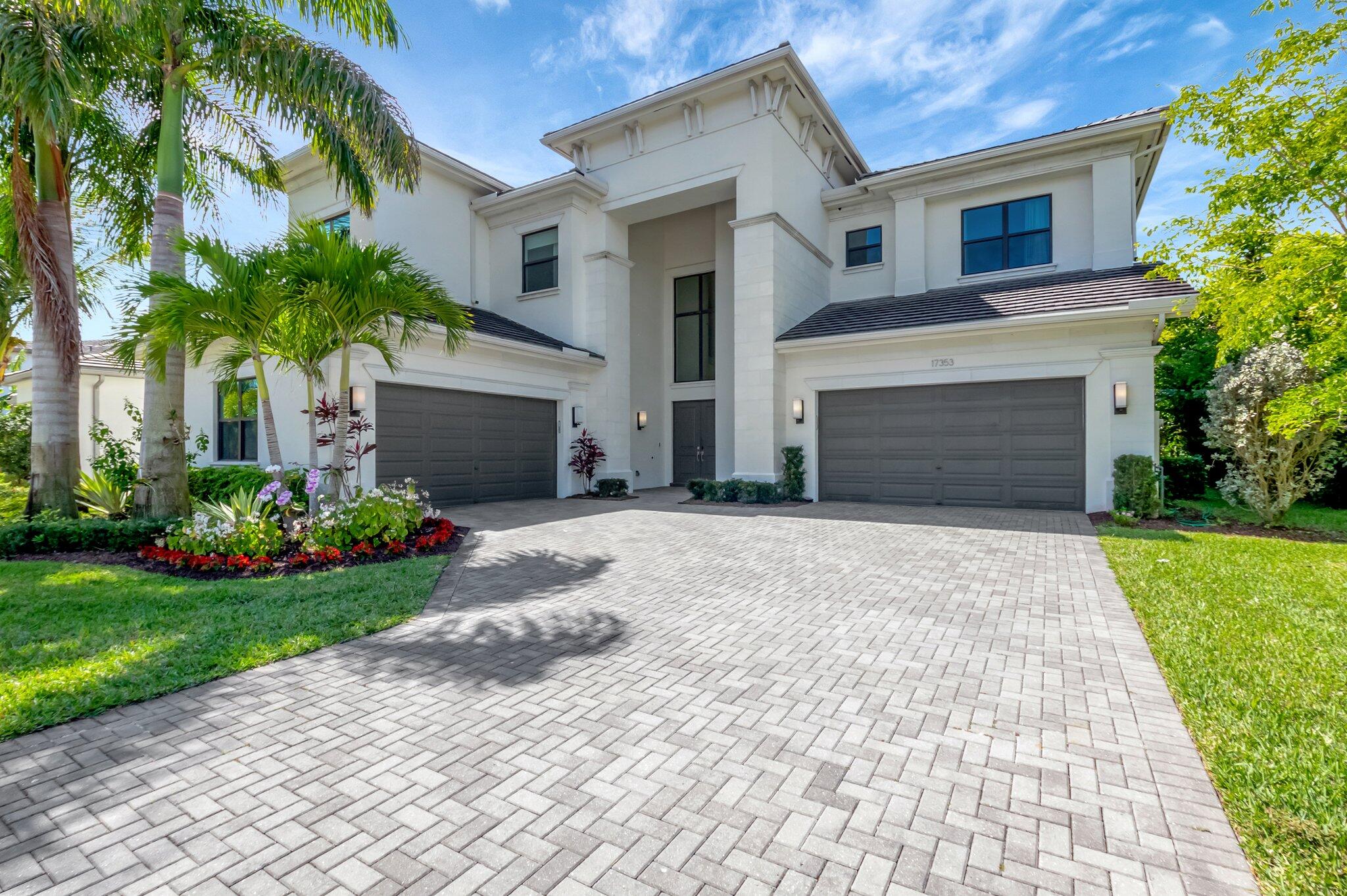 Stunning expansive lake view! Relish breathtaking Florida sunsets from your pool, patio, & balcony.  The pool & patio maximize the stunning lake view, enhanced by phantom screens & summer kitchen, creating an ideal setting. 
This home features 5 bedrooms, 6.1 bathrooms, loft, retreat, tailored great room & club room, wine display, & 4-car garage. The great room has been redesigned with a distinctive movable wooden room divider. The main floor is large-format porcelain tiles and the second floor is oak wood flooring. The kitchen is equipped with high-end appliances, Sub-Zero & Wolf, & premium finishes. The upstairs primary suite includes a bath that surpasses all expectations, a fully equipped closet & covered balcony. Each bedroom features custom closet designs. The lighting has been upgraded to powerful mini-recessed lights.
Situated in the esteemed Boca Bridges community, residents have access to exceptional amenities, including a vast clubhouse, a cutting-edge fitness center, tennis & pickleball courts, a resort-style pool, an indoor sports court, game & card rooms, a poolside bistro, a shaded playground, & a party pavilion. A dedicated social director organizes exclusive events to promote a lively community vibe. Located in Boca Raton on Lyons Road between Atlantic Avenue & Clint Moore Road, Boca Bridges is merely minutes away from the attractions of Delray Market Place, downtown Delray Beach, top-tier schools, award-winning golf courses, & beautiful beaches.