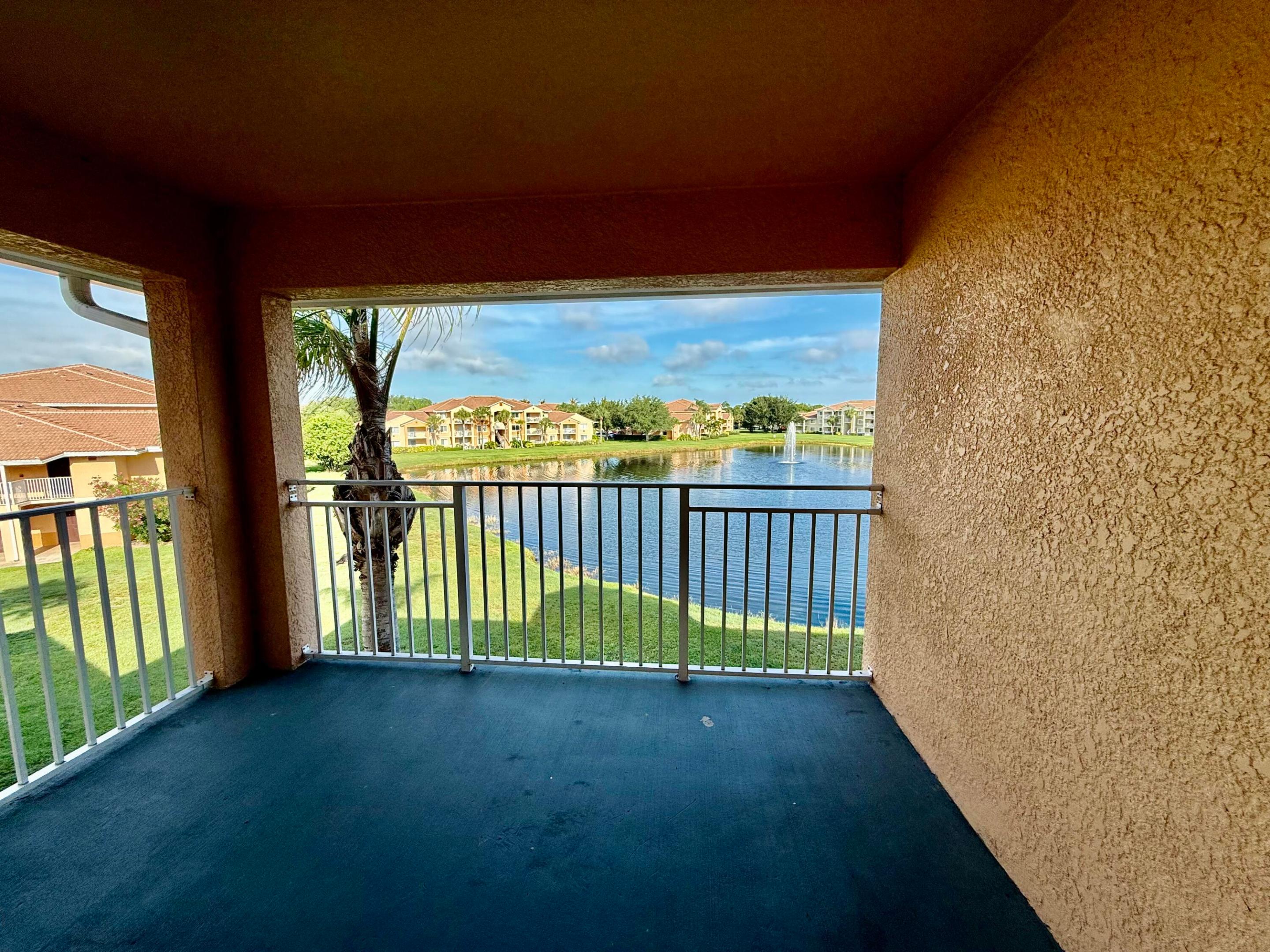 Beautifully updated 2-bedroom, 2-bath condo located in the heart of St. Lucie West! Freshly painted and move-in ready, this third-floor unit offers a spacious split-bedroom floor plan with peaceful lake views from the living room, bedrooms, and private balcony. The open kitchen features granite countertops, stainless steel appliances, and access to a separate laundry room. The primary suite includes a walk-in closet and dual vanity areas for added convenience. Located in a gated community with resort-style amenities including pool, clubhouse, fitness center, tennis courts, playground, and picnic area. Prime location close to I-95, the Turnpike, shopping, restaurants, and everything St. Lucie West has to offer!