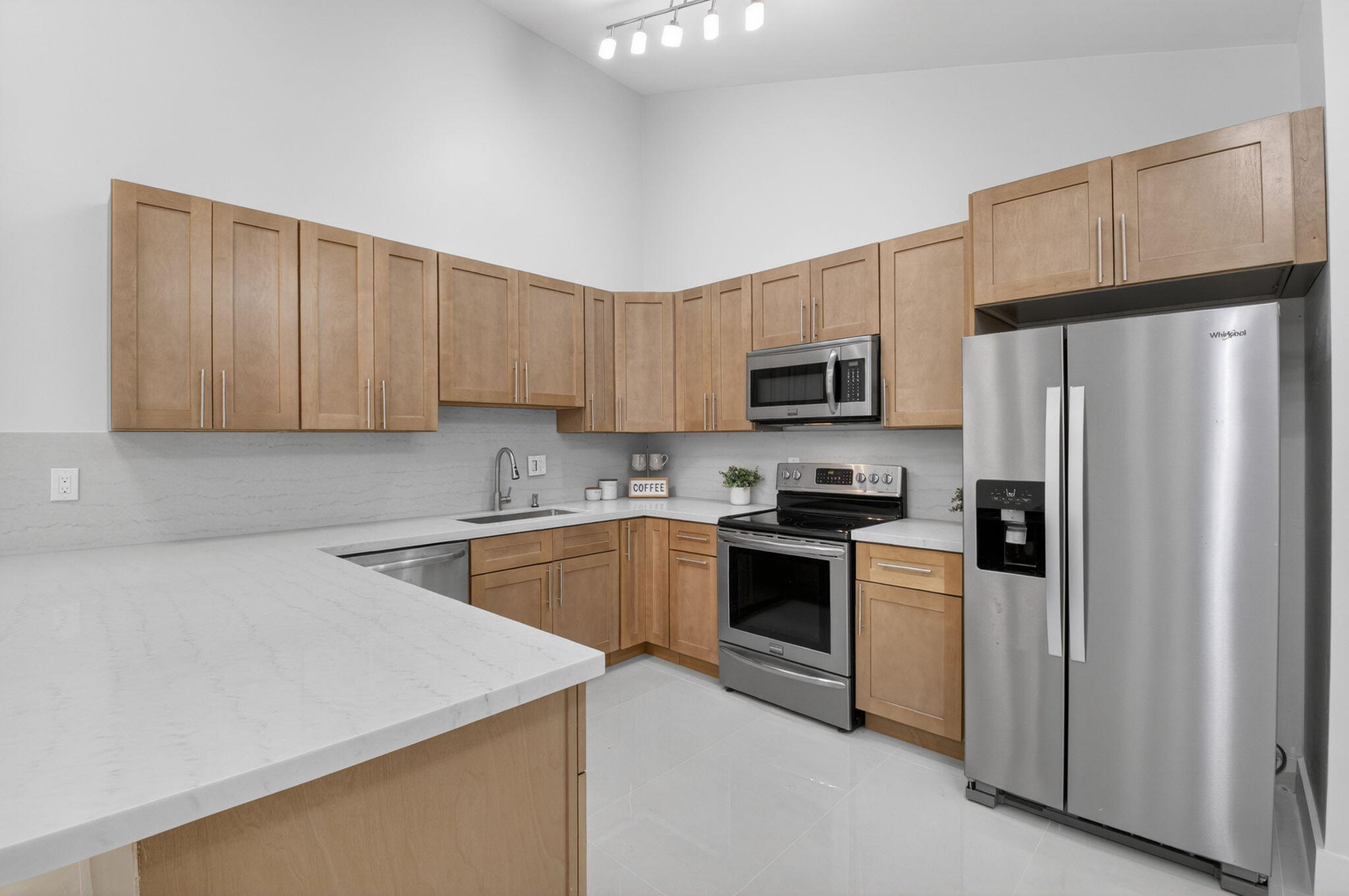 FULLY and NEWLY remodeled 3/2 villa with private courtyard and pool in beautiful Boca Gardens. This unit has it all..brand new porcelain floors throughout, brand new kitchen with quartz countertops and stainless steel appliances, new bathrooms, freshly painted throughout, smooth ceilings, closet organizers, and the list goes on. Washer/dryer in the unit. Beautiful private courtyard area fully screened in with a private pool and additional entertaining space. Fabulous landlord looking for a solid long term tenant.  Boca Gardens has top notch amenities including 3 pools, tennis, pickleball, playgrounds, fitness center, and more. Centrally located near great shops and restaurants and zoned for A rated schools.