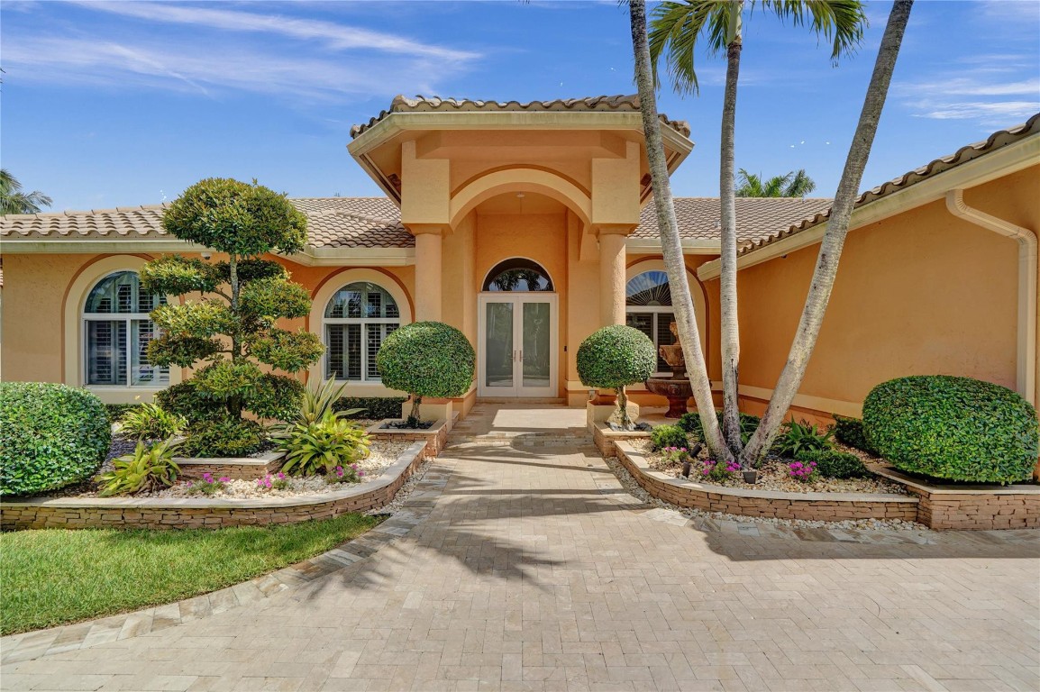 UNBELIEVEABLE upgraded home - this is a 5 bed/4 full bath home located on waterfront on a cul-de-sac in the sought after awesome community of Westport in Plantation.  You have to do nothing to move in - not even paint.  Roof (2015), Impact windows throughout, Full house Generac Generator, All hardwood flooring, Kitchen completely redone with High end appliances, Spectacular pool-heated- salt water system.  Two A/Cs (2015).  Sound system throughout.  Security Ring Sys. Outdoor camera system and spectacular outdoor lighting, partial finished attic, Full wet bar in w/auto ice-maker.  Extra Fridge in house hallway.  Tons of closets - most custom.  Gorgeous lighting & upgraded fans throughout.  The list is endless, Upgrade list attached to listing. Remaining items in house are negotiable