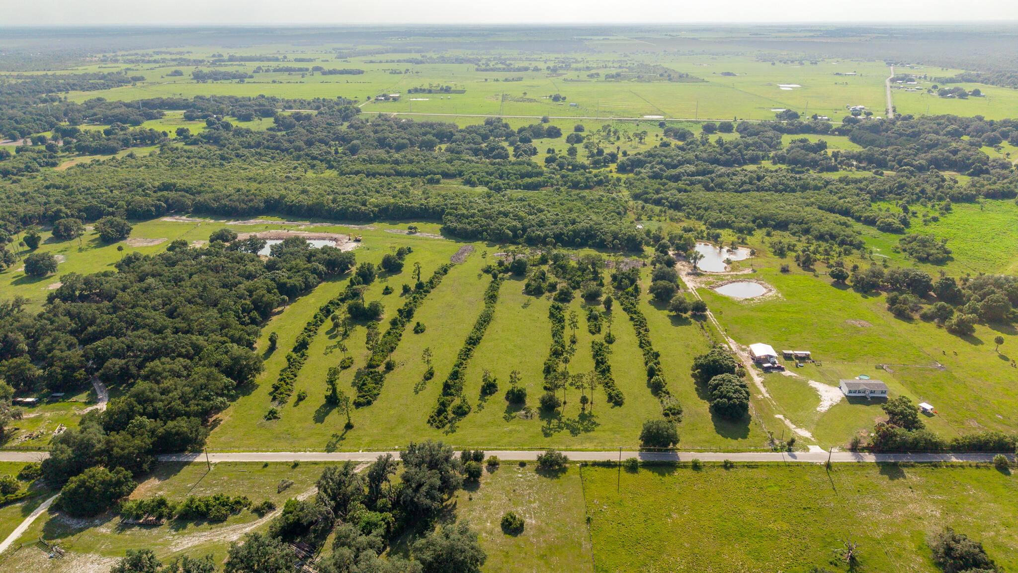 20 ACRES of Agricultural land in Basinger, North of Okeechobee County, Florida with NO HOA.  Discover the possibilities with this beautiful 20-acre parcel located in the northwestern section of Okeechobee.  This parcel is zoned Agricultural and ready for your cows and/or horses.  Create your own private retreat and build your forever home away from the hustle and bustle or city life.  With amble acreage and agricultural zoning, this property provides flexibility for a variety of uses.  Whether you're looking for land to build your dream home, expand your agricultural or equestrian operation,  or invest in land, this great opportunity to own a piece of Okeechobee's countryside is waiting for you!