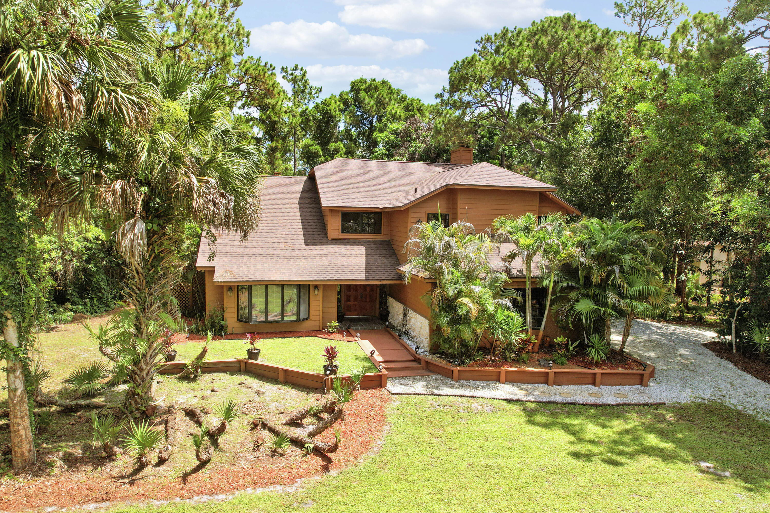 Discover the perfect blend of rustic charm and ultimate privacy in this stunning 4-bedroom, 3-bathroom, 2,958 sq. ft. estate. Located on the highly desirable north side of Indiantown Road, this home is tucked away at the very end of a quiet, dead-end street with only a handful of neighbors—offering a serene, traffic-free sanctuary you'll love coming home to. The thoughtfully designed floor plan features both a family room and a separate living/dining room as well as a cozy breakfast nook for casual mornings. Step outside to your massive pool flanked by two separate screened in patios, or unwind on the private balcony overlooking your peaceful property. Recent updates include 2023 Roof, 2023 A/C, 2025 Hot water tank.  Don't miss the chance to own acreage in Jupiter Florida while still being minutes from world class beaches, dining, and A-Rated schools.Schedule your private your today!