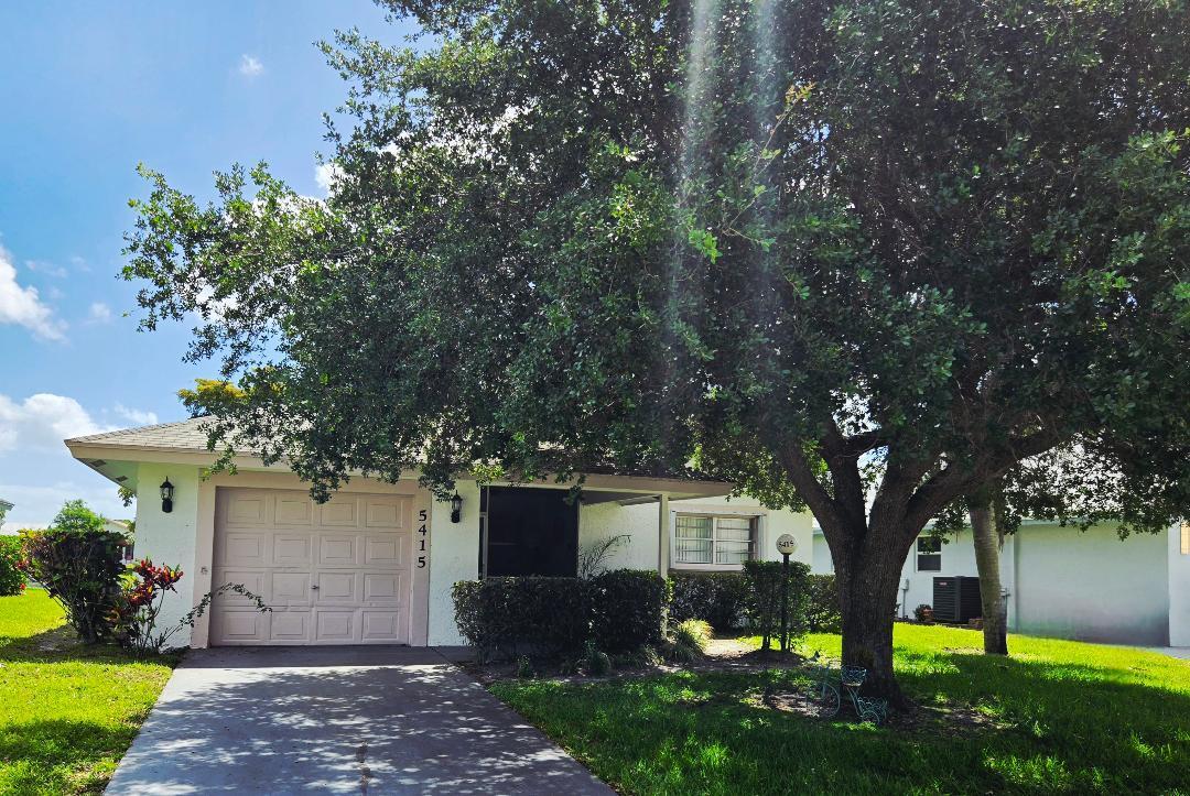 Welcome to this charming single-story residence in the conveniently located golf course community of Cypress Lakes  Original owner has lovingly maintained this home  offering 1,541 square feet of well-appointed living space with vaulted ceilings. This waterfront property features two bedrooms and two full bathrooms and a bonus room facing the sparkling lake and a fully enclosed patio/sunroom, providing comfortable accommodations.  The single-car garage adds convenience for vehicle storage and protection. Situated in the established Cypress Lakes Golf Course Community.  Excellent amenities include community pool, gym, spa, putting greens, pickleball, tennis, clubhouse and more all included with your reasonable monthly maintenance fees.  Golf Course membership not required.    New Roof 2004, A/C 2014, Water Heater 2018 Carpet has been removed offering a blank canvas for the flooring of your choosing.