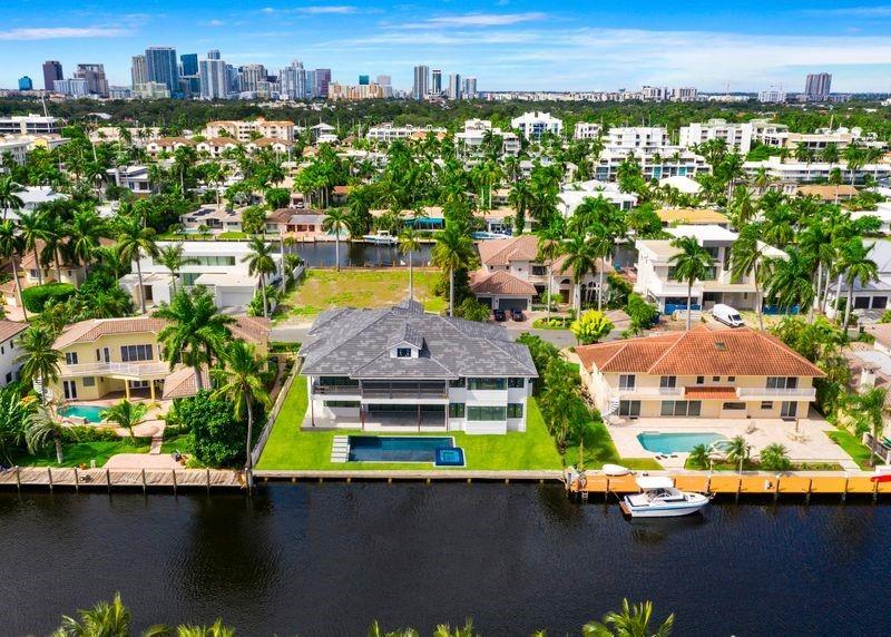 Offering the very latest in British West Indies design & construction! Winning collaboration between Tuthill Architecture & Gulf Builders this East facing residence offers custom quality construction plus open, functional floor plan designed for the ultimate SoFlo waterfront lifestyle. Located on one of the most desirable Las Olas Isles (underground utilities & majestic palms). Attention boaters canal 9ft at low tide & 110ft wide ensures great protected dockage upto 80ft. Enjoy amazing great room & open Chef's kitchen-dining-living concept. Separate Club/Game Room, Wine Cellar,1st level Bedroom. Large covered terrace & Summer Kitchen. Ultra-luxurious Master Suite with separate spa style baths & walk-in closets. Plus 3 large Bedroom Suites. Huge balcony. 3rd level Play/Media/Home Office.