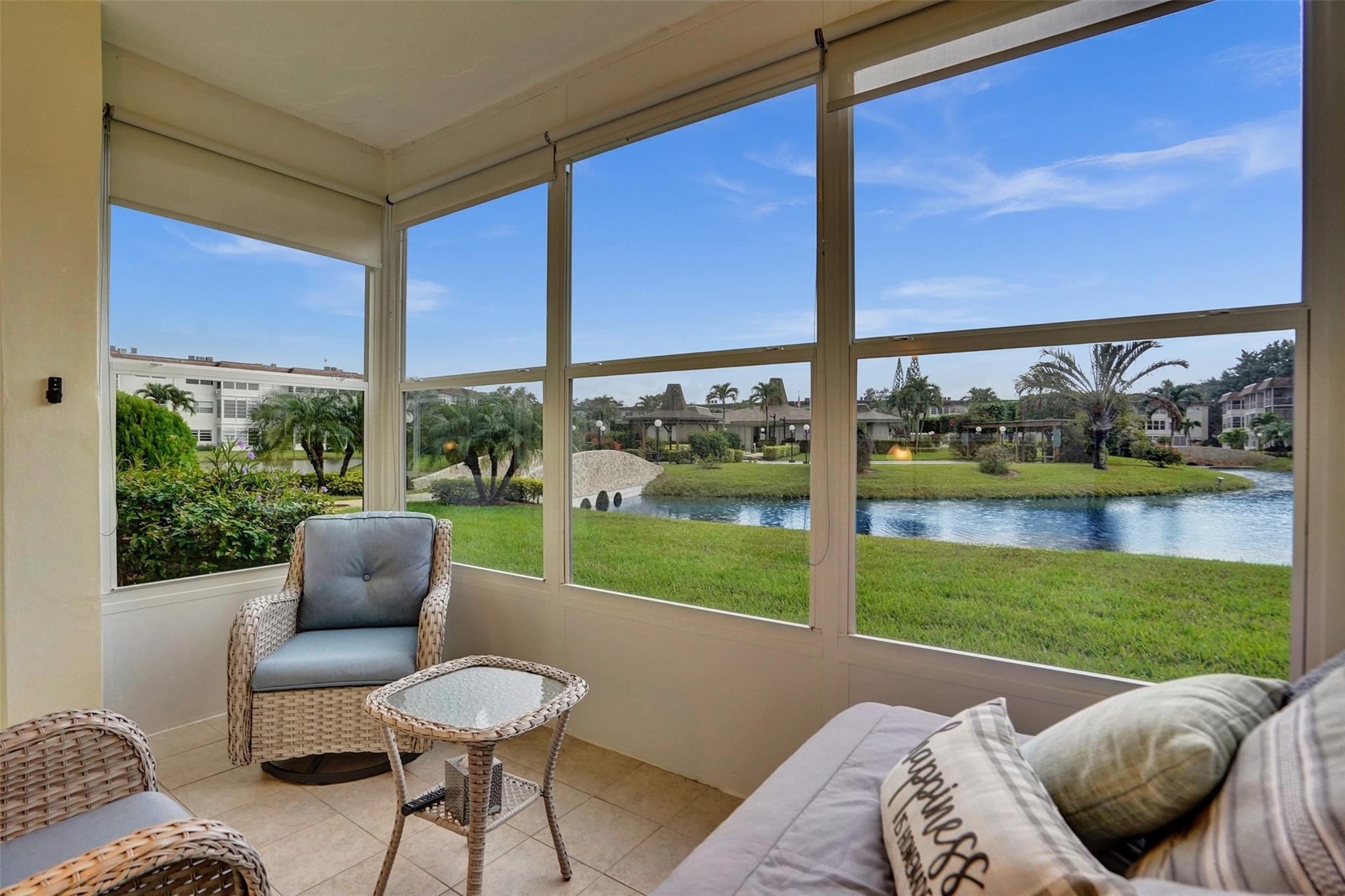 Gorgeous 1 bedroom 1 bathroom condo in Seagrape Gardens of 55+ Hawaiian Gardens Phase 8. Beautifully done enclosure of the balcony for a picturesque view of the lake and clubhouse. Enjoy ceramic tile and thoughtful upgrades throughout. Sold fully furnished. Experience modern living in a friendly and peaceful community. Come see this unit today and make it your very own.