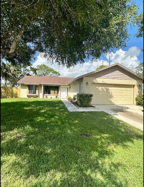 NO HOA - UPDATED SINGLE FAMILY HOME. Come and see this beautifully remodeled single family home. 3 bedroom / 2 bath, 2 car garage, large screened patio with fenced yard (pets considered case by case), brand new appliances. Community playground and sports areas and basketball. Washer and dryer inside garage. Super close proximity between Wellington and West Palm Beach, access to all shopping and restaurants!