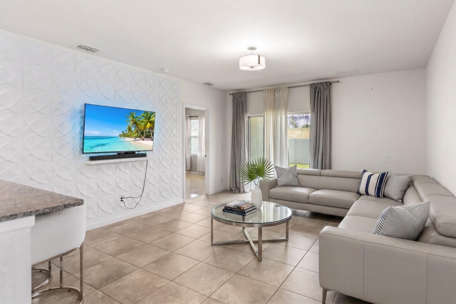 This beautiful CBS 3/2 home was built in 2022 and has all the smart home bells and whistles including wifi controlled thermostat & garage opener, and low homeowner's insurance! Open concept kitchen situated between the living area and dining room. The kitchen overlooks the living area and covered & screened lanai and back yard. The owner's suite, located at the back of the home for privacy, has an Ensuite bathroom and access to kids room, if needed. Carpeting was removed and replaced with tile in a few bedrooms. Backyard is fenced in with 6ft privacy fencing. Crosstown Commons is very active with lots of seasonal neighborhood events organized by the residents, and LOW HOA of only $38/mo! Don't forget to check out the zero entry community pool and playground near the entrance! HOA fee's includes common areas, recreation center, cable, internet, playground & Pool. Hurricane Shutters included. If you want to be in Tradition but not pay all of the extra Tradition fees, this is it! Tradition offers many retail stores, restaurants, hospital, parks, walking/running trails, events, and more!
