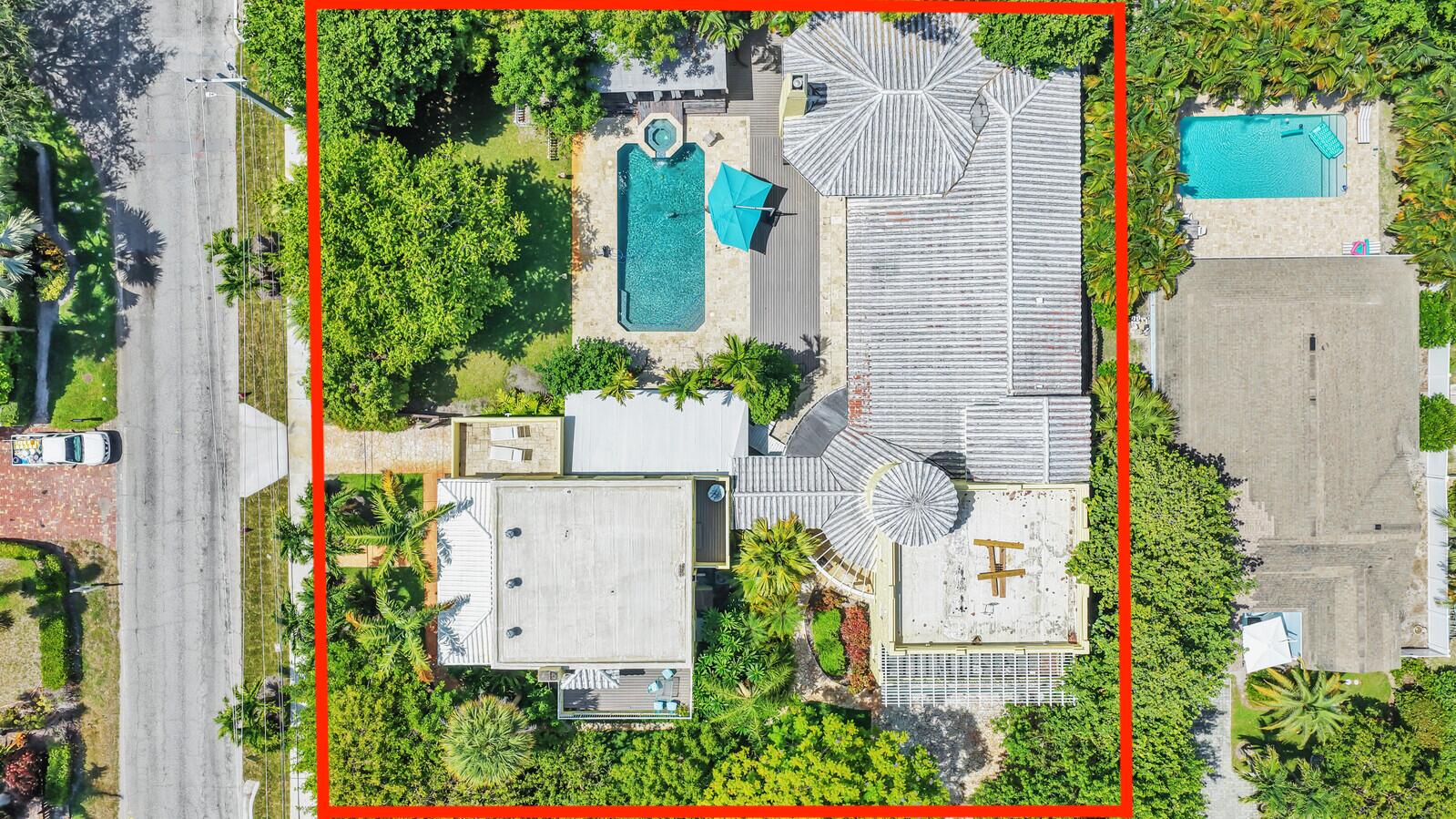Rarely does a property of this size, character, and location present such an exceptional opportunity. Just minutes from the vibrant shops, restaurants, entertainment, and pristine beaches of Delray Beach, this iconic residence offers tremendous potential for investors, developers, or buyers looking to create a truly one-of-a-kind estate. Originally built in 1925 and affectionately known as The Pineapple House, this nearly 8,000-square-foot home sits on an expansive property and features 7 bedrooms, 6.5 bathrooms, a 3-car garage, and separate living quarters. While the home is in need of updating and renovations, its impressive footprint, unique architectural design, and versatile floor plan provide endless possibilities to restore, reimagine, or redevelop to suit your vision. Whether  you're seeking to renovate and preserve its historic charm, create a luxurious custom estate, accommodate multi-generational living, or explore redevelopment opportunities (subject to local zoning and approvals), this property offers exceptional flexibility. The original four-bedroom residence showcases beautifully restored Dade County pine floors, while the kitchen features Carrera marble countertops, a built-in breakfast nook, and premium gas appliances. A thoughtfully designed 2001 addition expanded the home with three additional bedrooms and a private primary wing complete with a walk-in wine cellar, media room, and an architectural turret with a spiral staircase leading to private guest or in-law quarters—ideal for extended family, a nanny, or long-term guests. French doors open to an expansive, lushly landscaped backyard designed for the ultimate South Florida lifestyle. Enjoy an oversized pool, spa with waterfall feature, covered entertaining patio, outdoor summer kitchen, and generous green space for family gatherings, pets, or future enhancements. With its historic character, substantial square footage, highly desirable location near Atlantic Avenue, and outstanding value-add potential, this is a rare opportunity to transform a landmark property into an extraordinary residence or investment.