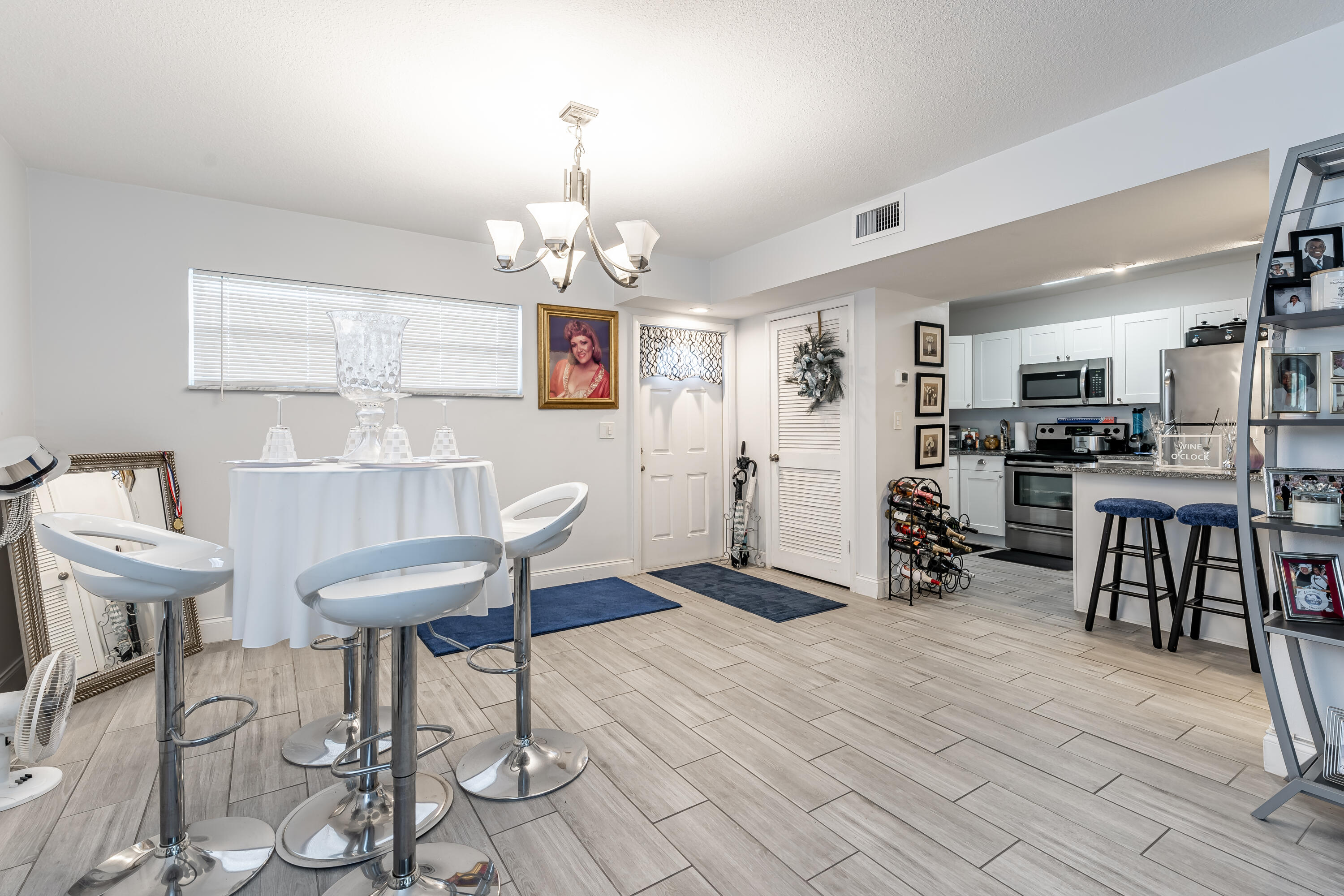 SHOWING AVAILABLE JUNE 1, 2026. MOST BEAUTIFUL! EVERYTHING NEWISH- Eat-in Kitchen w/ granite counters and SS appliances, designer bathrooms, plank tile flooring throughout. IMPACT GLASS! PAR 3 Golf Course view. 24 hr guard gated. FREE golf (except cart fees) on two 18 hole courses (PGA & Par3); Also, available for Lease-Option Purchase. Amenities include Restaurant, Billiard Room, Bbq/Picnic Area, Clubhouse, Courtesy Bus, Exercise Room, Heated Pool, Library, Putting Green, Sauna, Shuffleboard, Tennis, Pickle Ball, Vehicle Wash Area, Electric Car Charging Station. Close to shopping, dining & highways. 15 min. to the beach. Association says 55+ age required. GREAT OPPORTUNITY TO GET THE BEST!