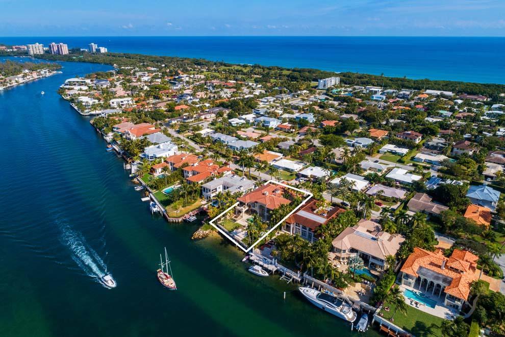 Boasting 90 feet of direct Intracoastal waterfrontage, 465 NE Spanish Trail, Boca Raton represents great waterfront living in the heart of South Florida. With over 10,000 total square feet and six bedrooms plus guest house, the residence showcases the scenic water views with floor to ceiling windows and doors throughout. Interior details include rotunda, marble floors, dramatic stairway and impressive master wing. Exterior features include private gated circular driveway, gated entry courtyard with fountain, infinity edge pool with spa and private dock with ocean access via nearby Boca Raton inlet. Conveniently located blocks from the beach and East Boca Raton's boutiques and restaurants as well as a pleasant drive from Delray Beach, Palm Beach and Fort Lauderdale. Come enjoy the luxury! Located just blocks from the beach, this property provides the privacy of a gated retreat and the convenience of the nearby shops and restaurants of Royal Palm Plaza and Mizner Park. Enjoy a pleasant drive along A1A to Delray Beach's Atlantic Avenue, Palm Beach's Worth Avenue and Fort Lauderdale's Las Olas Boulevard. Boaters will appreciate the 90 feet of direct Intracoastal "no wake zone" waterfrontage, private dock and close proximity to the Boca Raton Inlet for adventures on the high seas. Getaways are a breeze with several private jetports and three international airports easily accessible via Federal Highway or Interstate 95.

The dual gated entryways open to the expansive circular drive, additional driveway and two separate garages for ample parking. The impressive portico entry and decorative gate lead to the serene courtyard with fountain and access to the main house, guest house, one-car garage and walking path to the pool and waterway. The foyer provides the first glimpse of the interior's marble floors and picturesque views of the pool and waterway beyond. The rotunda above the foyer has custom lighting that enhances the homes' elegance. With floor-to-ceiling windows and a volume ceiling that opens to the second floor, the living room has a fireplace and glass door that leads to the pool and waterway. The dining room overlooks the courtyard and is connected to the kitchen via the butler's pantry. The chef's kitchen offers two islands, snack bar, dining area and top-of-the-line appliances including Sub-Zero, Viking, Bosch and Monogram. The kitchen is open to the family room which has a fireplace, powder room, expansive views of the pool and waterway and glass doors that open to the covered loggia and summer kitchen. There is a first floor guest bedroom that can serve as an office with closet and full cabana bath. The guest quarters are easily accessible with an impressive staircase and an elevator located in the vestibule. The laundry room and two-car garage are located off the kitchen for convenience. 

The second floor has a stunning open corridor that overlooks the living room and foyer with the rotunda above. The spacious master wing has a large bedroom with water views, sitting room with private balcony and outdoor spiral stairway to the pool, dual walk-in closets and master bath with jetted tub, glass walk-in steam shower and dual vanities and water closets. There are three guest bedrooms with private baths on the north side of the residence and one guest bedroom with private bath and balcony on the south side. In addition to the six bedrooms in the main house, there is a guest house off the courtyard which features a bedroom with morning bar, bath and closet. 

The landscaped grounds provide plenty of green space and are enhanced by custom lighting. Outdoor living is easy with an expansive covered loggia that flows to the poolside terrace and leads to the waterway and private dock. The infinity edge pool with spa invites hours of fun in the sun with plenty of room for lounging poolside. Enjoy entertaining and al fresco dining with the summer kitchen's grill, wet bar and bar-top seating. Pack a picnic and enjoy time at the beach located just blocks away. Nautical options are endless with 90 feet of direct Intracoastal waterfrontage and private dock. Recreational boaters and serious yachtsmen alike will appreciate the easy ocean access via nearby Boca Raton inlet. 

This inviting East Boca Raton property has plenty of room for residents and guests alike with 6,753 square feet under air, 10,342 total square feet, seven total bedrooms and seven full and one half bathrooms. Additional features include seven-zone air-conditioning system, impact windows, double-sided electric fireplace, volume ceilings throughout, elevator, two-car garage and a separate one-car garage. Luxury living awaits at this waterfront estate!