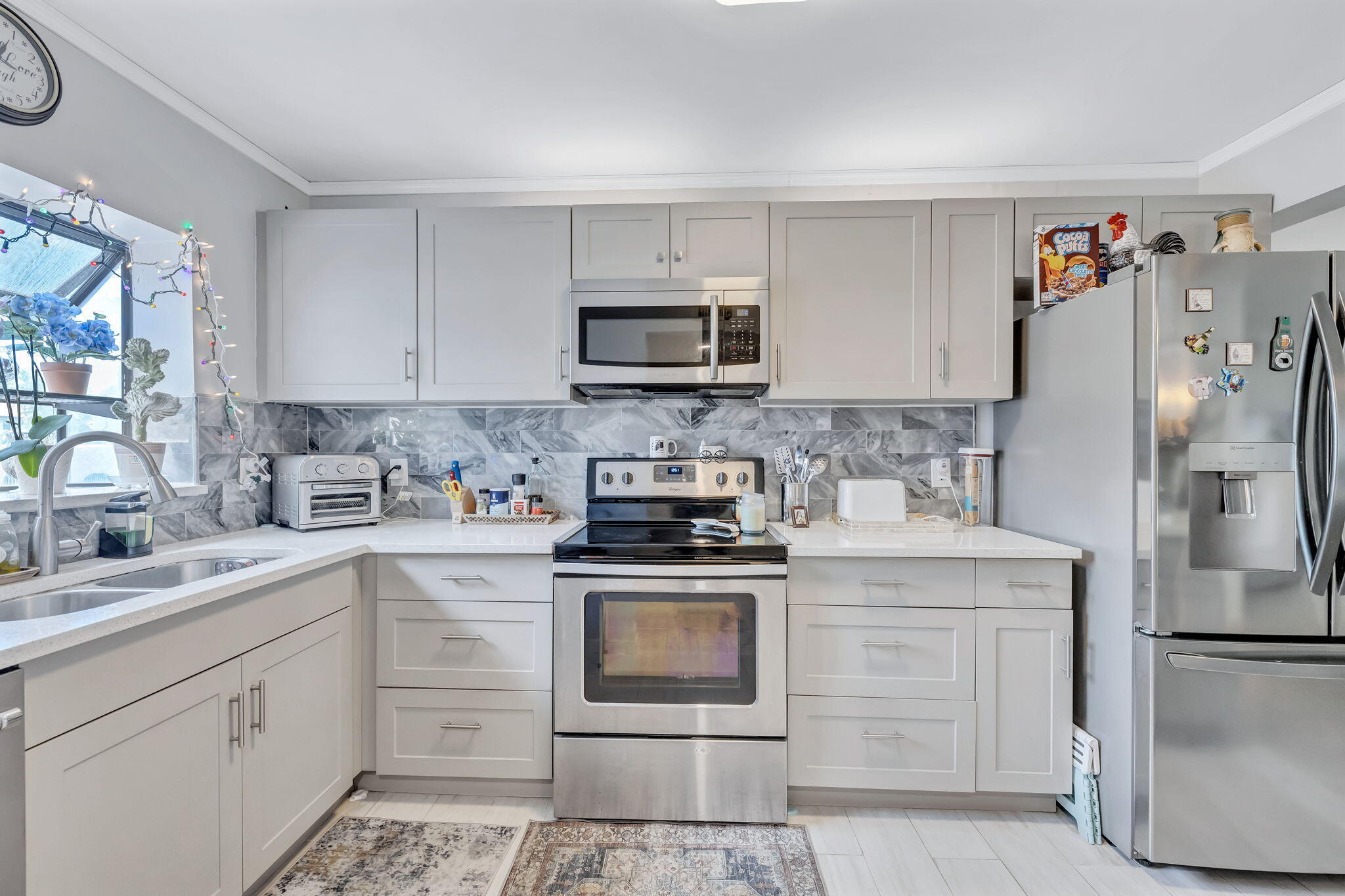 One of the largest floor plans in Independence Bay and designed for buyers who value space, flexibility, and lifestyle. This true ground-floor residence offers a split-bedroom layout, dual-entry, renovated kitchen with updated appliances, open living and dining areas, and an oversized Florida room large enough for a gym, office, play area, second living room, or creative space. Wake up to soft eastern morning light and unwind with western sunset skies in your Florida room. The HOA covers security, roof replacement, exterior maintenance, and resort-style amenities including fitness center, tennis, and rare boat parking access.  Come see your new space in person.   Disclaimer: Per tax records, the property is recognized as a 3-bedroom unit; however, the third room does not contain a closet.