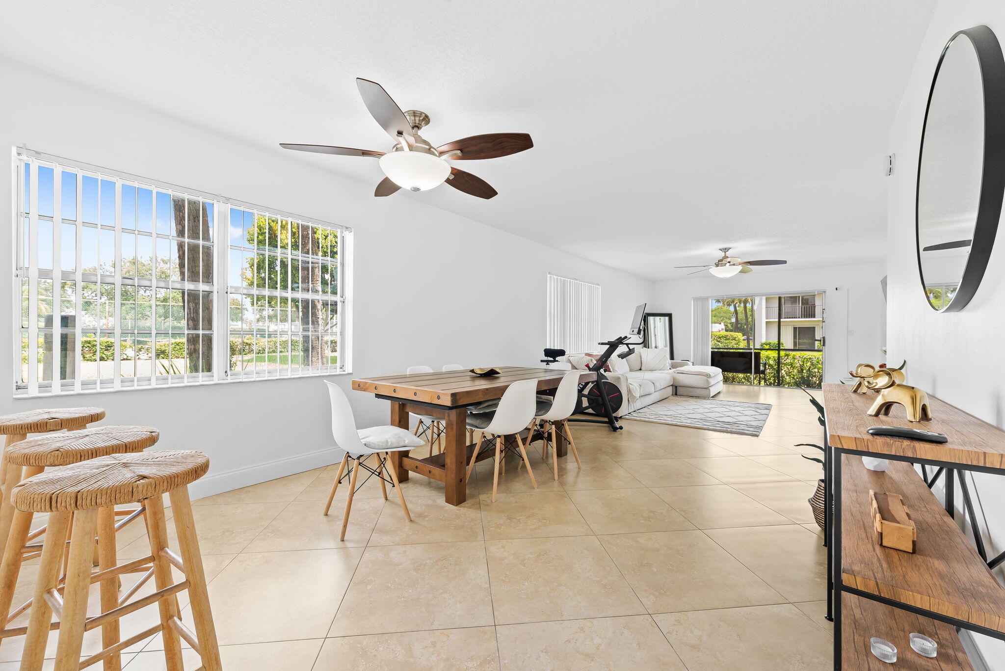 Welcome to Sabal Palms! This beautifully updated 1st-floor 2-bedroom, 2-bath condo offers the perfect blend of comfort, style, and convenience in the heart of Delray Beach. Step inside to a spacious open-concept layout featuring oversized neutral tile flooring throughout, abundant natural light, and a bright, airy living space that flows seamlessly to the screened patio overlooking lush green space and community tennis courts. The updated kitchen is complete with rich wood cabinetry, granite countertops, stainless steel appliances, and modern backsplash details. Both bathrooms have been tastefully renovated with timeless finishes, while the generously sized bedrooms offer ample closet space and a clean, modern feel. Additional highlights include in-unit washer/dryer, assigned covered parking, and ground-floor convenience with easy access. Sabal Palms is a well-maintained community ideally located just minutes from Downtown Delray, beaches, shopping, dining, and major highways. Perfect for full-time living, seasonal use, or investment opportunity!