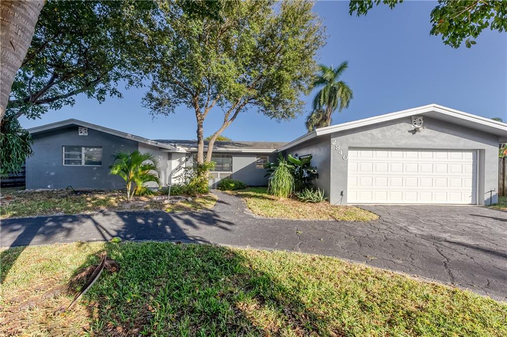 AFFORDABLE LIGHTHOUSE POINT HOME,   3 bed 2 bath on quiet street in the very desirable Lighthouse Point (LHP).  Split floor plan. BRAND NEW KITCHEN AND BATHROOM. Polished terrazzo flooring throughout. Dedicated laundry room.  Mature trees provide beautiful shade in front yard. Back yard is a blank canvas with concrete patio and grass for you to turn into an oasis. Extreme close proximity to grocery stores, restaurants, marina and retail shopping.  LHP also provides a community bus service to all the local areas from Deerfield to Pompano Beach. LHP is its own city with their own police and fire departments within minutes of this home. You will want to see this home.
