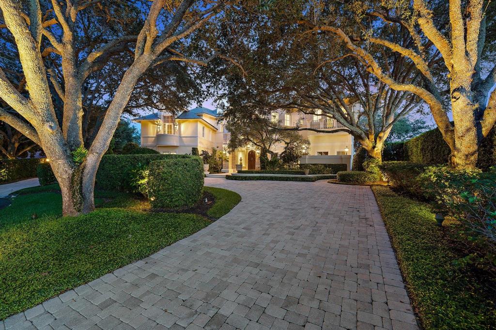 First time on the market!  This palatial European estate (all poured concrete)offers unparalleled construction quality and opulent, comfortable luxury. Beautifully sited behind the gates of exquisite Jupiter Hills, this home offers ultimate privacy + scenic serenity. Entry foyer leads to a 2 story living room w/ floor to ceiling windows + domed ceiling.  Timeless elegance blends with modern functionality.  Premiere Impact windows and doors throughout, Crestron system + motorized screens and shutters.  Featured in Florida Design magazine, this designer furnished home is curated to perfection on every level.   Living room leads to a cozy library w/ fireplace + bar.  A True chef's kitchen features imported Italian stone flooring, beamed ceiling, grand pantry and Viking + Thermador appliances Off the kitchen a spacious informal den leads to a screened loggia overlooking pool, pond + scenic grounds.  A commercial elevator offers easy access to all 3 levels (3rd floor is massive useable attic).  The home's 5 bedrooms are well spaced, with each offering ensuite bath + generous closets.   The owners suite with fireplace offers sumptuous luxury with dual marble floored bathrooms + room sized closets.  All upstairs rooms open to stunning lanai w/ sweeping golf + pond views.  Additional rooms include a very large double office complete w/ fridge, powder room + grand lanai.  Additionally, a walk in wine cellar and spacious multi purpose bonus room.   Outdoor area is Gorgeous!  Stone patios and an Infinity pool overlook an idyllic and beautifully landscaped lake, which opens to the golf course, set far enough away for privacy.   A beautiful life awaits you in this exceptional residential work of art.  No membership required.   Close to best beaches and all that Jupiter has to offer!