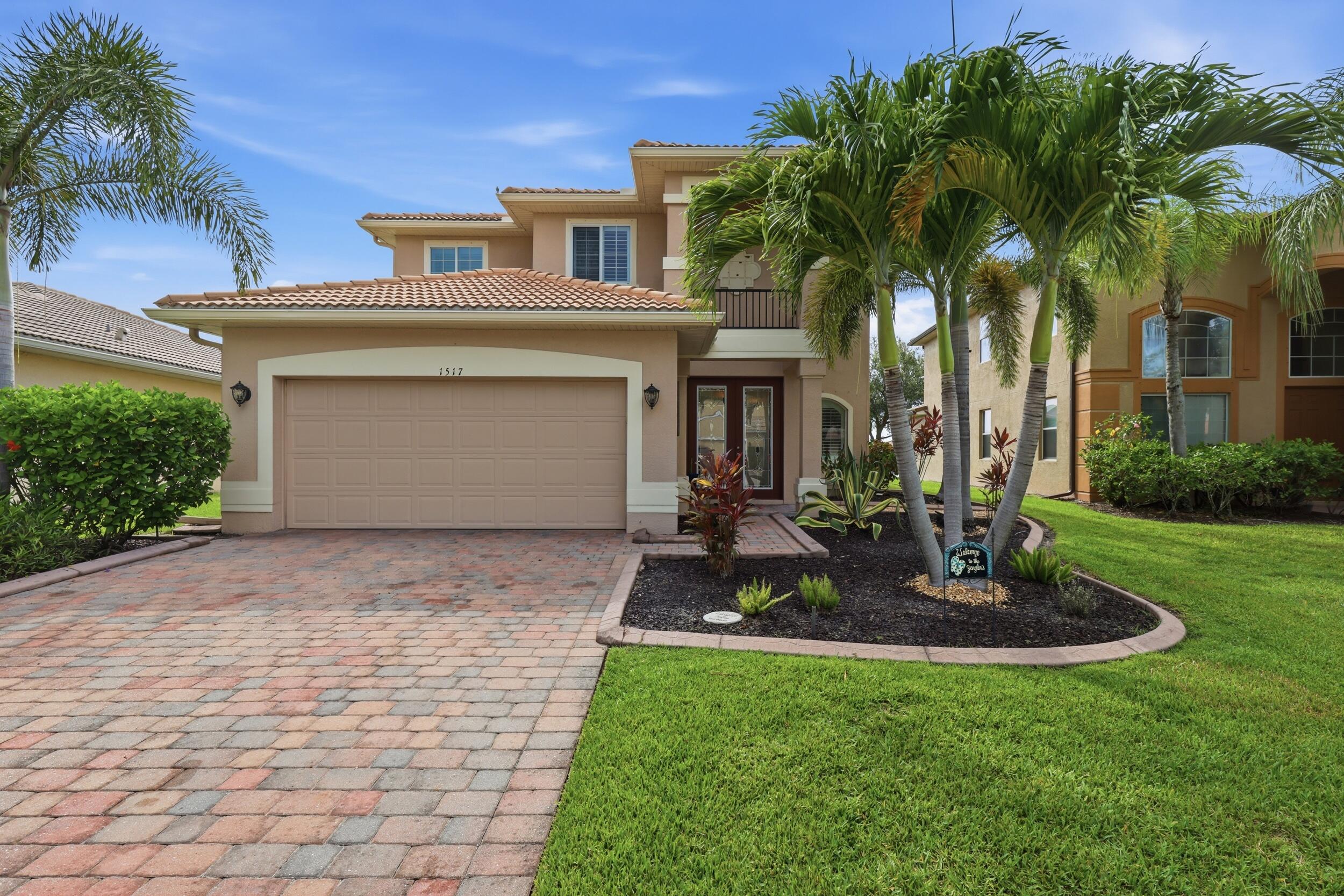 Enjoy the best of the Naples lifestyle in this beautifully maintained 3-bedroom plus den, 2.5-bath pool home located within the guard-gated community of Valencia Golf & Country Club. Built in 2011 & offering over 2,500 square feet of thoughtfully designed living space, this home combines comfort, functionality & exceptional indoor/outdoor living. Step outside to your private backyard retreat featuring a heated saltwater pool&spa (2019), expansive screened lanai & custom outdoor kitchen while enjoying peaceful lake views &  spectacular Florida sunsets.  Inside, you'll appreciate the spacious open floor plan with volume ceilings, crown molding, hard-surface flooring throughout the bedrooms, (see additional supplement remarks)  granite countertops, stainless steel appliances, plantation shutters, an interior laundry room, and a versatile den ideal for a home office, media room, or guest space. A three-car garage and paver driveway provide additional convenience and curb appeal.  Valencia Golf & Country Club offers an outstanding amenity package including a guard-gated entrance, clubhouse, resort-style community pool, fitness center, billiards room, library, theater/media room, dog park, and an 18-hole Gordon Lewis-designed public golf course with no mandatory golf membership, allowing residents to enjoy championship golf without the expense of bundled golf fees.  The community is conveniently located near shopping, dining, top-rated schools, and major roadways while offering the privacy and tranquility of one of North Naples' most desirable gated communities.  Buyer-friendly community requirements include no HOA approval, no HOA application fee, a $150 transfer fee, and a $1,000 capital contribution.