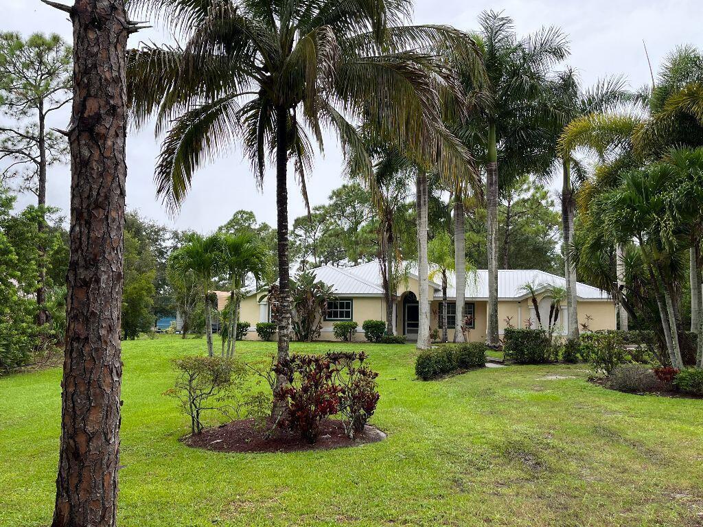 Rare rental opportunity in the desirable Indian River Estates community of Fort Pierce! This beautifully updated home sits on a spacious 0.91-acre lot and offers 3 bedrooms plus a den, providing plenty of room to live, work, and relax. The brand-new kitchen features stainless steel appliances, modern cabinetry, and an open design overlooking the dining area and living room—perfect for everyday living and entertaining. The home offers tile and laminate flooring throughout, with carpet only in the small den.  The spacious primary suite features a beautifully renovated ensuite bath with a brand-new walk-in shower, relaxing soaking tub, and dual vanities. Step outside to the screened back porch overlooking the expansive backyard. With nearly an acre of land, there's plenty of room to park your boat, RV, or other recreational vehicles.  Additional features include a 2-car garage, spacious living areas, and a desirable open floor plan.  Monthly rent: $3,100.  Lawn care is to be paid by tenant for an additional $140 per month. Conveniently located in the sought-after Indian River Estates neighborhood, you'll enjoy easy access to beaches, marinas, shopping, dining, schools, and major highways. This move-in-ready home is available for immediate occupancy!