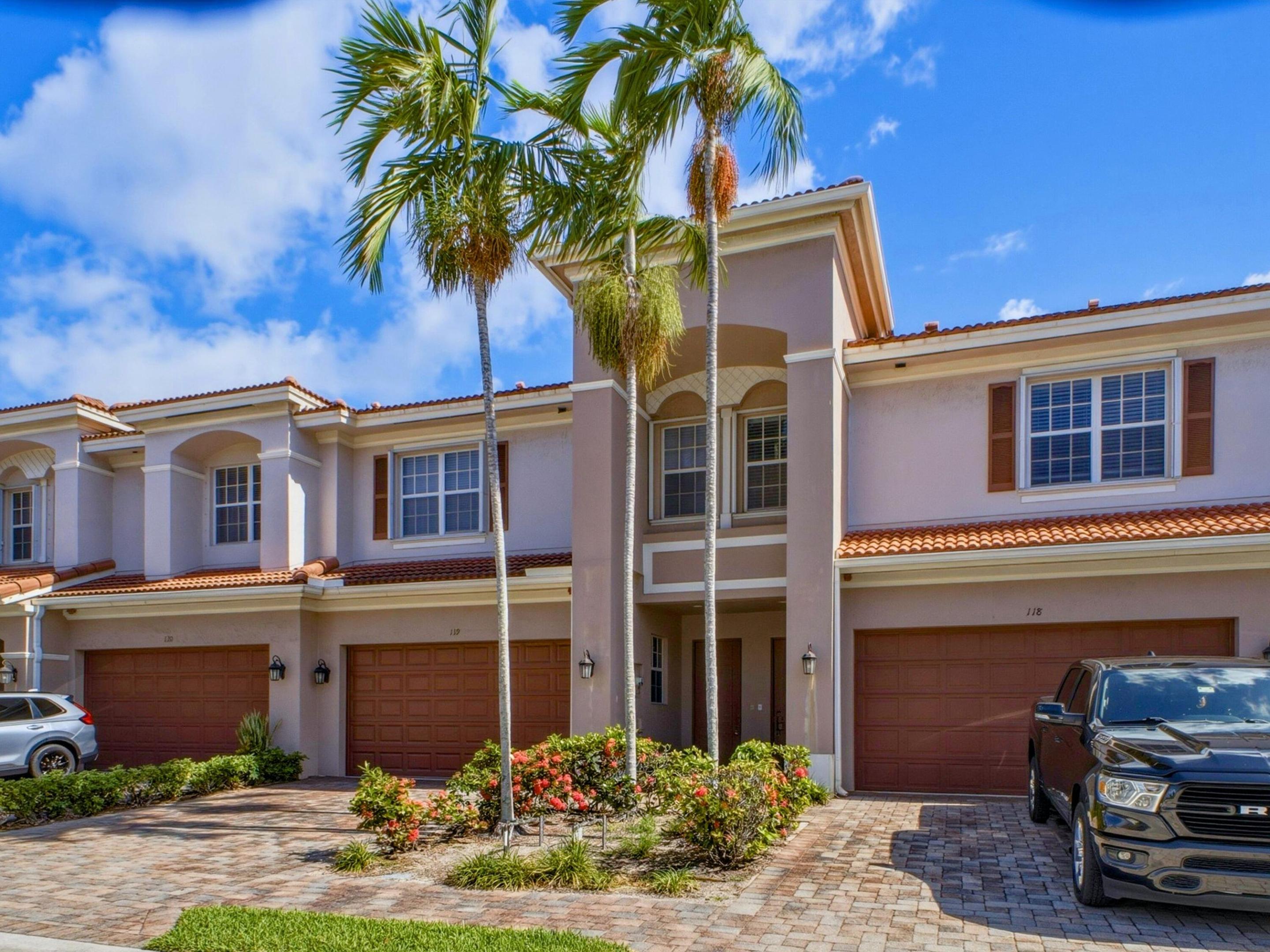 Welcome to 119 Lancaster Road, a spacious 3-bedroom, 2.5-bath townhouse situated in the desirable Carriage Pointe community of Boynton Beach. Offering 2,209 square feet under air, this residence provides a bright and comfortable layout with generous living spaces designed for both everyday enjoyment and easy entertaining. The home features stainless steel appliances, ample kitchen cabinetry, open living and dining areas, and a combination of tile and luxury vinyl flooring throughout, with no carpet. Upstairs, the oversized primary suite offers a relaxing retreat with a walk-in closet and a private en-suite bath complete with dual vanities, a soaking tub, and a separate shower. A spacious loft adds excellent versatility and can be used as a home office, second living area, playroom,  or media space. Two additional bedrooms provide comfortable accommodations for guests, or flexible living needs. Additional highlights include fresh interior paint, a private patio area, a 2-car garage, and an extended driveway for added parking convenience. Carriage Pointe offers sought-after amenities including a community pool, cable, tot lot, sidewalks, and a low HOA. Ideally located near Caloosa Park, I-95, shopping, dining, beautiful beaches, and the popular restaurants and entertainment of Downtown Delray Beach, this home combines size, functionality, and a convenient South Florida location.