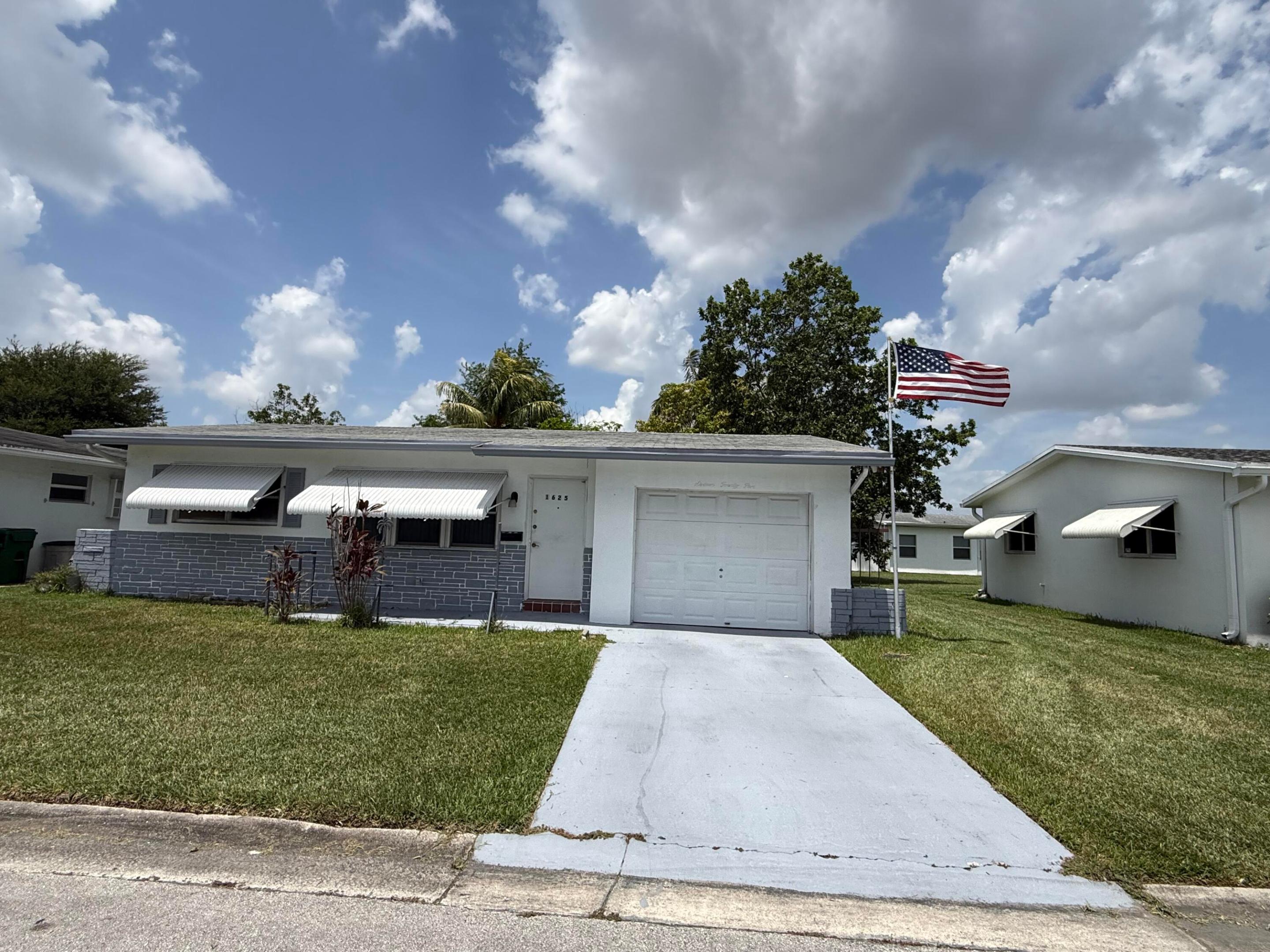 Charming 2-bedroom, 1-bath single-family home with a 1-car garage located in a desirable 55+ community in Margate. This well-maintained home features a newer A/C , and hurricane protection shutters for added peace of mind. Conveniently situated in a great location close to shopping, dining, medical facilities, and major roadways. Easy to show, use showing time. The homeowner's association maintains a top-notch clubhouse complete with a full kitchen, heated pool and patio with beautiful music to enjoy while you swim and relax, pool tables, a game room, and offices to better serve homeowners.  Enjoy water robics, bingo, line dancing, parties and more.