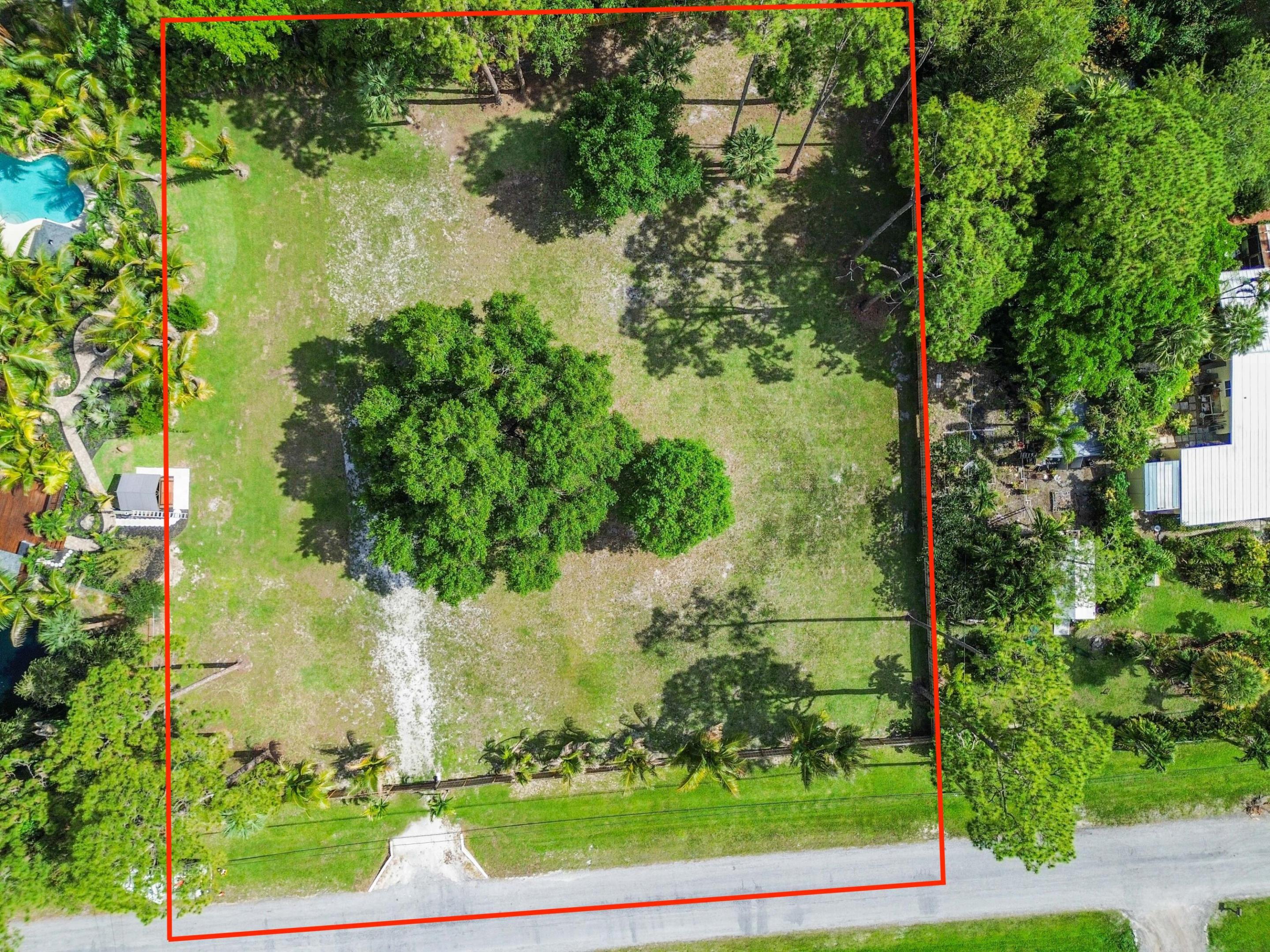 Discover the perfect opportunity to build your ultimate Florida retreat on this expansive, prime vacant lot in the highly desirable community. Offering a rare blend of tranquil country living and unbeatable convenience, this pristine piece of land is a blank canvas just waiting for your vision.   Also, available is the property directly to the east which is currently on the market. Property address is 13480 42nd Rd and MLS number is B26034161.   The lot has already been cleared & grated and is ready to be built on and includes full fencing! This generous parcel provides endless possibilities to design and construct a custom home exactly to your specifications.  With plenty of acreage to work with, you will have more than enough room to add a resort-style pool, build a detached garage or workshop, plant a thriving garden, or even bring your horses. It is also the ideal setup for securely storing your RV, boat, and all your recreational toys right on your own property. Enjoy the peace, privacy, and breathing room of a rural, agricultural-residential lifestyle while remaining just a short drive from modern conveniences. You will be minutes away from top-rated schools, local parks, grocery stores, and major highways, with the world-class shopping, dining, and beautiful beaches of West Palm Beach all within easy reach. This property offers ample space for a custom estate, outbuildings, and a pool. With no HOA to limit you, you are free to park your RVs, boats, and commercial vehicles. As an equestrian-friendly property, there is plenty of room to accommodate horses and enjoy the area's local trails. It truly provides the perfect balance of secluded country living and city accessibility. Do not miss this chance to secure your own slice of paradise in one of West Palm Beach's most sought-after acreage communities. Walk the lot, dream big, and start planning your future today!