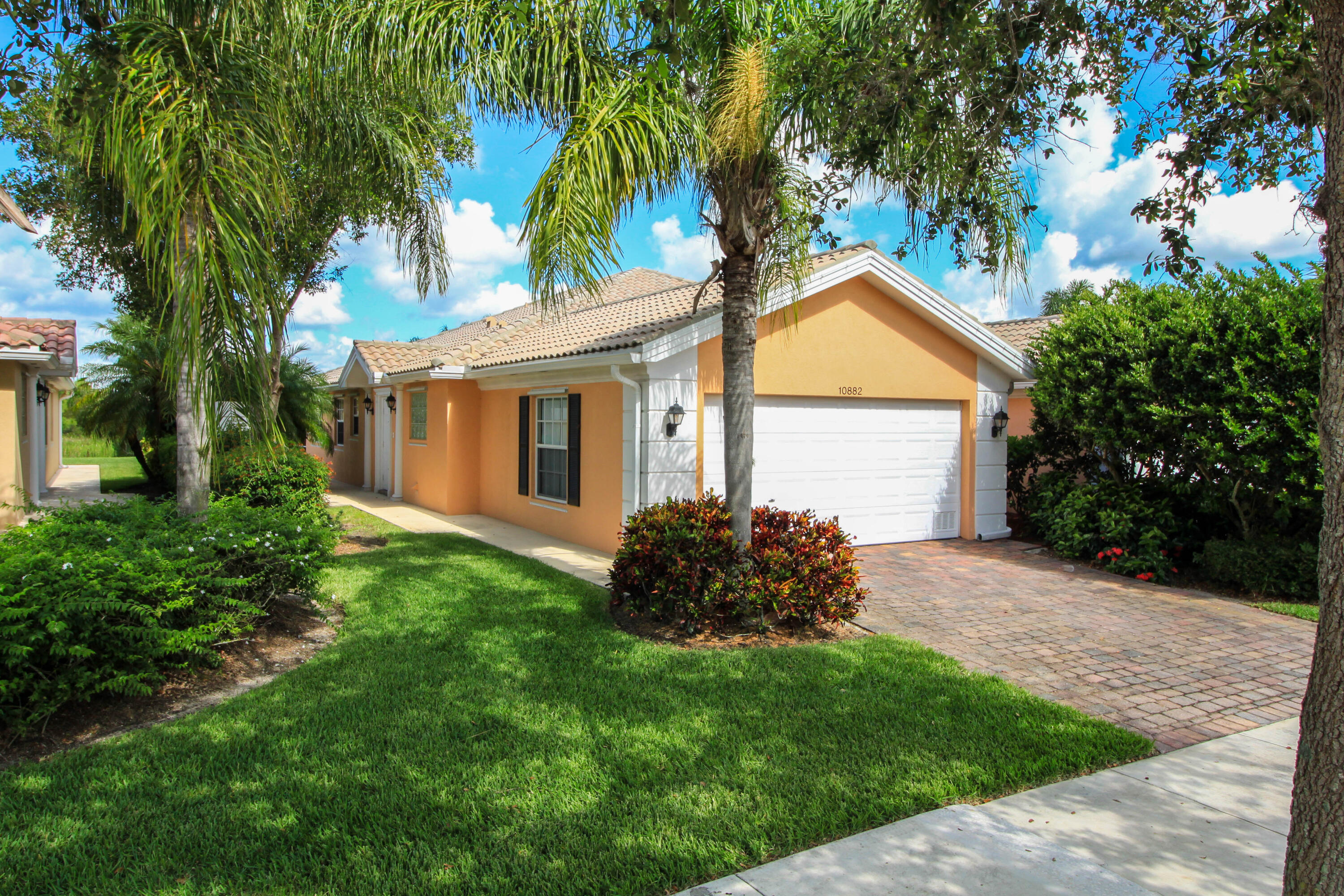 Enjoy resort style living in the highly desirable gated community of The Lakes at Tradition. Immaculate 2 bd/2 bath luxury home with a private screened patio overlooking the beautiful preserve. Poured concrete construction and barrel tile roofs. Open floor plan with two primary, separate/split suites. Huge closets, great storage and quartz countertops in kitchen. Includes washer/dryer, basic cable, high-speed internet, security alarm and lawn care. 2 car garage with workshop area. Exterior freshly painted. Includes access to all resort amenities including pool, pickleball/tennis, gym, clubhouse and social activities. Great location in the heart of Tradition, walkable to Publix, restaurants, shops and more.