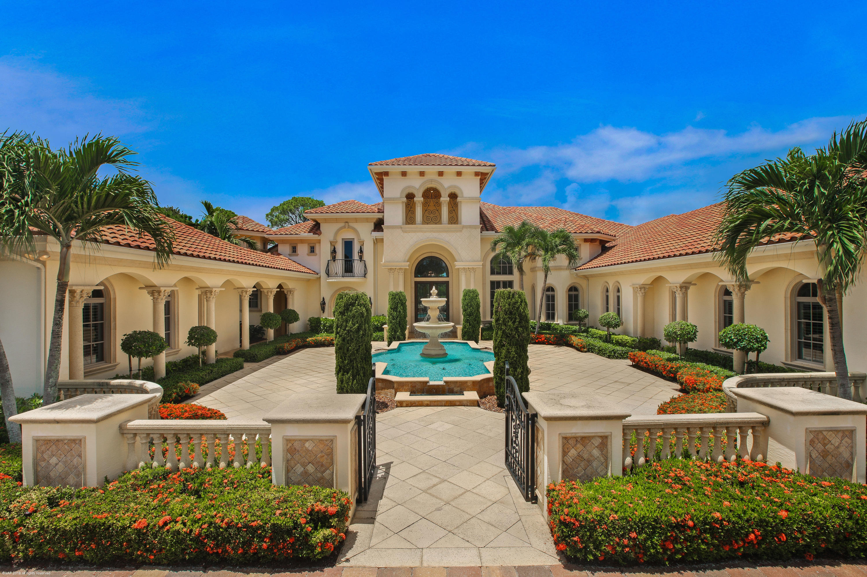 Elegant Custom Estate residence on desirable one acre home site with stunning golf course view!  This home has it all, Club Room, Formal and informal living areas, expansive master suite with spacious closets for both him and her. His and Her's master bathrooms, with a separate sitting area off the master.  2 Story study with handsome built ins and spiral stair case, Club room with wet bar, beautiful covered lanai with large bar area and a beer tap... the perfect home for entertaining!  Splash in the pool or soak in the spa while taking in tropical views of paradise.  This home boasts a whole house generator, water filtration system, newer Air conditioning units, 2 steam showers, beautiful marble floors, gorgeous onyx, hand painted ceilings, too many stunning appointments to list them all