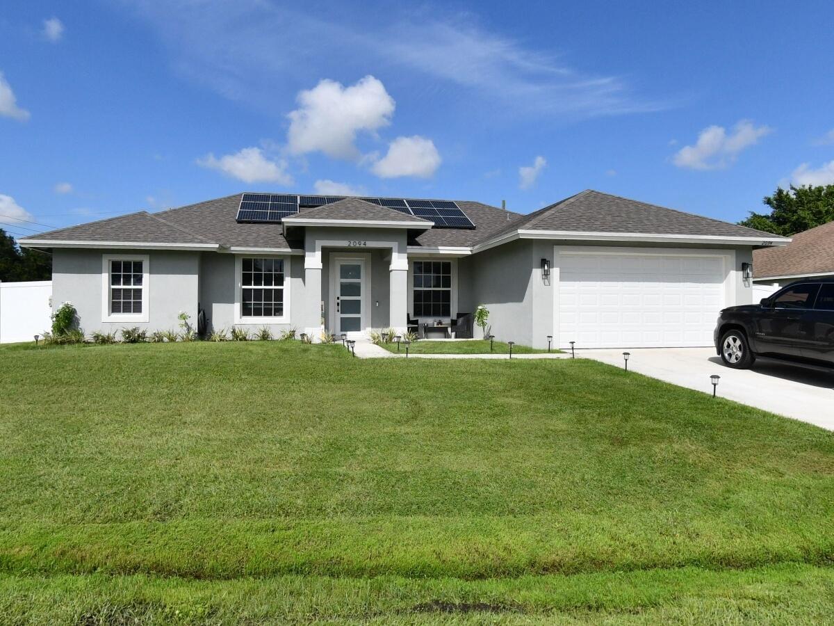 Welcome to this spacious, single-story residence situated on an oversized corner lot. This home features a split floor plan with 4 bedrooms and 3 full bathrooms, including a cabana bath ready for a future swimming pool. The fourth bedroom includes its own private bathroom and a complete closet system. The modern kitchen is equipped with quartz countertops, a hood stove, and stainless-steel appliances. Additional highlights include laminate flooring, stylish barn doors, impact windows, and a tiled master bathroom with a freestanding soaking tub. The property features numerous upgrades throughout including solar panels. We invite you to come and see it for yourself. Professional photos coming soon.