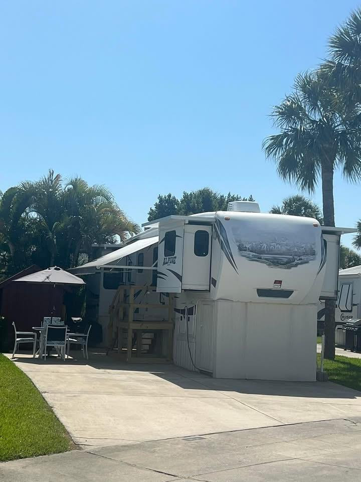 Best Buy Value for this 2014 RV with lots of amenities. Full size Shower & Bath, Large Master King bedroom with lots of closet space. 2nd full door exit in bedroom .Large living room with 2 sleeper sofas, 65"TV and electric fireplace. Lovely island kitchen with full size fridge,  coffee bar cabinet, 4 person dining. Outdoor 5x7 electric shed . Surrounded by mature landscaping.  Excellent condition like new home with built in vacuum system and lots of great storage A BEST VALUE Property!