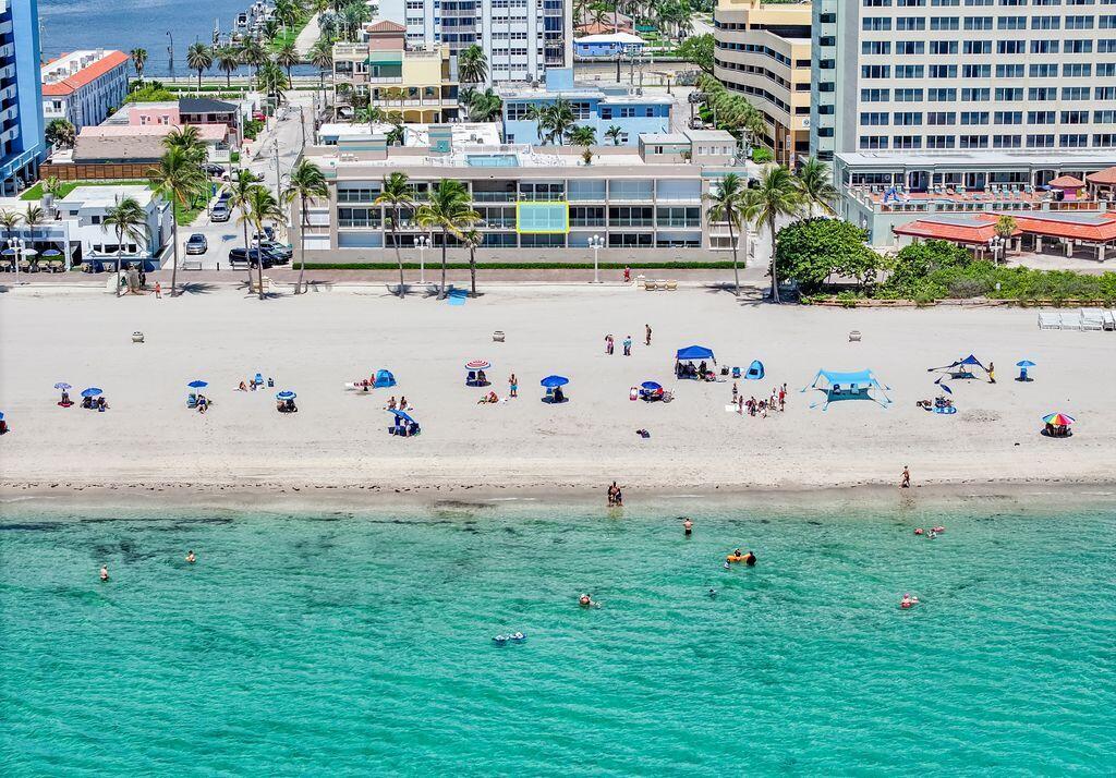 RARELY AVAILABLE THIS SECOND FLOOR DIRECT OCEANFRONT-BEACH AND BROADWALK FRONTAGE ALONG HOLLYWOOD BEACH.  LARGE 1 BEDROOM WITH 2 FULL BATHS. SPACIOUS SIZED UNIT WITH LARGE LIVING AND BEDROOM AREAS.  BOTH BATHROOMS REMODELED.  CENTRAL A/C  ALL TILED THROUGHOUT, TANKLESS WATER HEATER.    KITCHEN HAS FULL SIZE WASHER/DRYER IN UNIT.   INVESTORS CAN RENT RIGHT AWAY.   EVERYONE LOVES THIS SMALL BOUTIQUE BUILDING, WITH ROOFTOP HEATED POOL AND AMAZING ROOF DECK FOR SUN AND WATCH DRAMATIC SUNSETS.  THIS IS YOUR PERFECT BEACH RESIDENCE, OR RENT WHEN YOU ARE NOT USING.  SMALL EXERCISE ROOM ON SITE.  ONE CARPORT ASSIGNED PARKING SPACE.  BUILDING HAS RESERVES AND PASSED ALL INSPECTIONS! COME MAKE THIS YOUR BEACH HOME.   EASY TO SHOW CALL LISTING AGENT.