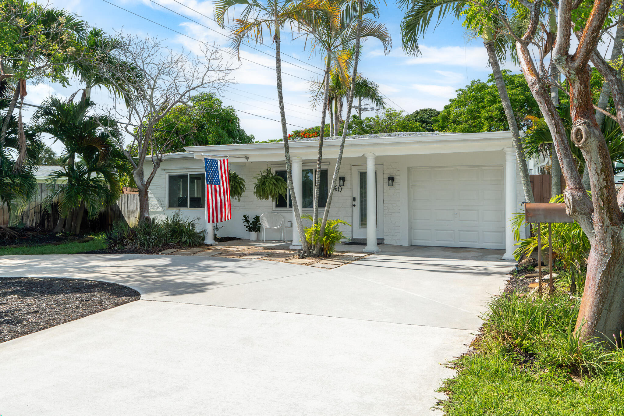 Welcome home to this inviting Mid-Century Modern gem in the vibrant North Andrews Gardens neighborhood of Oakland Park. This charming 2-bedroom, 2-bath residence is well-maintained and blends classic character with thoughtful updates and comfortable indoor and outdoor living spaces. Features include: updated bathrooms and kitchen with newer appliances, spacious screened-in Florida room, deck, new roof and impact windows (2022), electric vehicle charger, murphy bed, circular driveway, custom-built storage, and custom wood-crafted doors/trim. Your peaceful retreat is in the middle of everything with a convenient location near downtown Oakland Park, Wilton Manors, Las Olas, I-95, beaches, shopping, entertainment and restaurants. There is no HOA! A must see - just move in and enjoy!