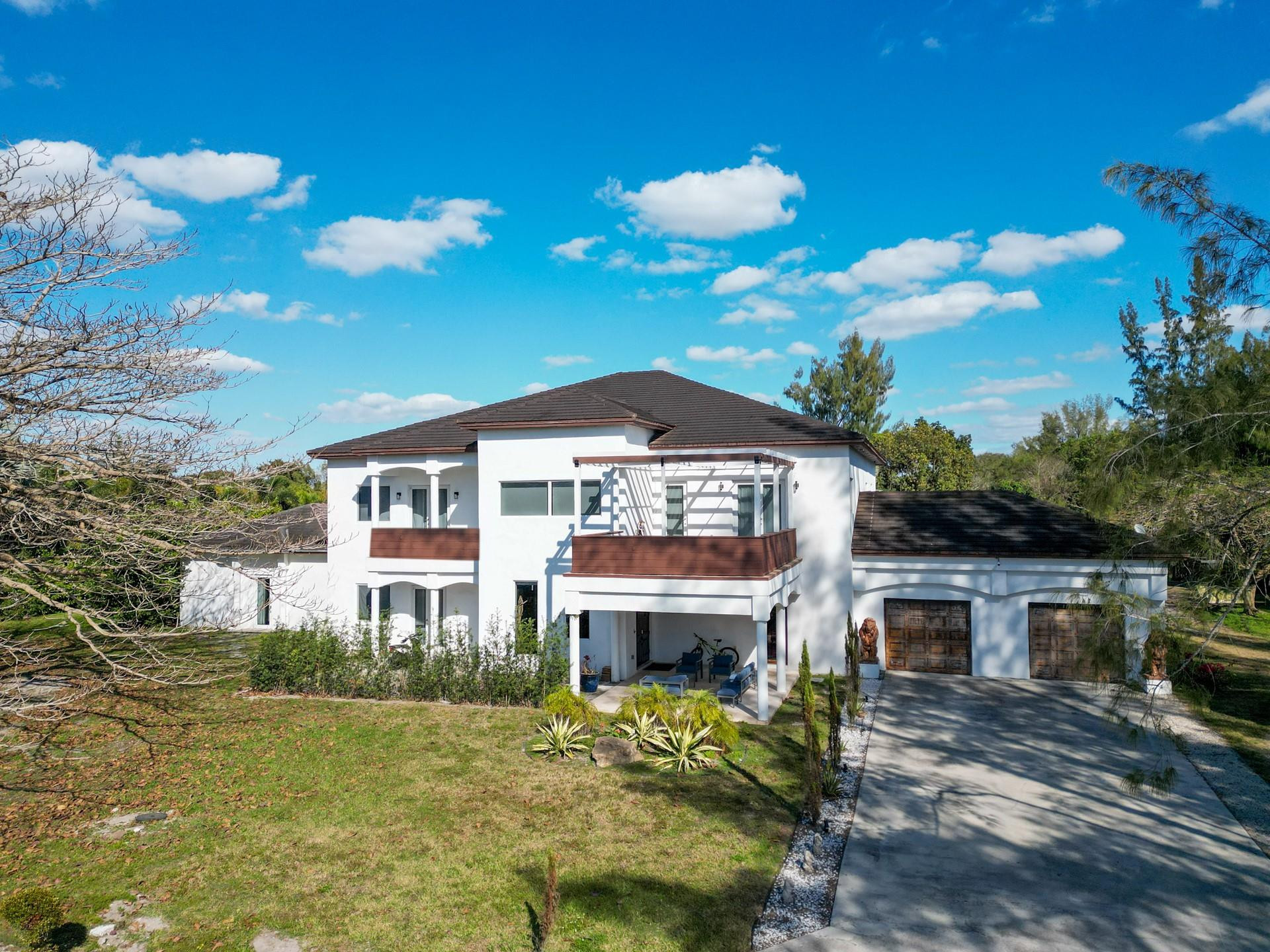 Situated on an expansive 2.23-acre estate, this exceptional property at 4601 SW 143 Avenue offers a rare opportunity to own a private retreat in the heart of SW Broward County.   Surrounded by lush greenery and set back for maximum privacy, this residence delivers the perfect blend of space, tranquility, and upscale lifestyle potential. The generous acreage allows for endless possibilities—whether envisioning a custom outdoor oasis, resort-style pool, guest house, or curated entertaining spaces.The property's unique setting provides a serene, estate-like atmosphere while remaining conveniently located near major highways, shopping, dining, and top-rated schools. Nearby luxury properties and multi-million-dollar estates further enhance the long-term value and prestige of this Estate.