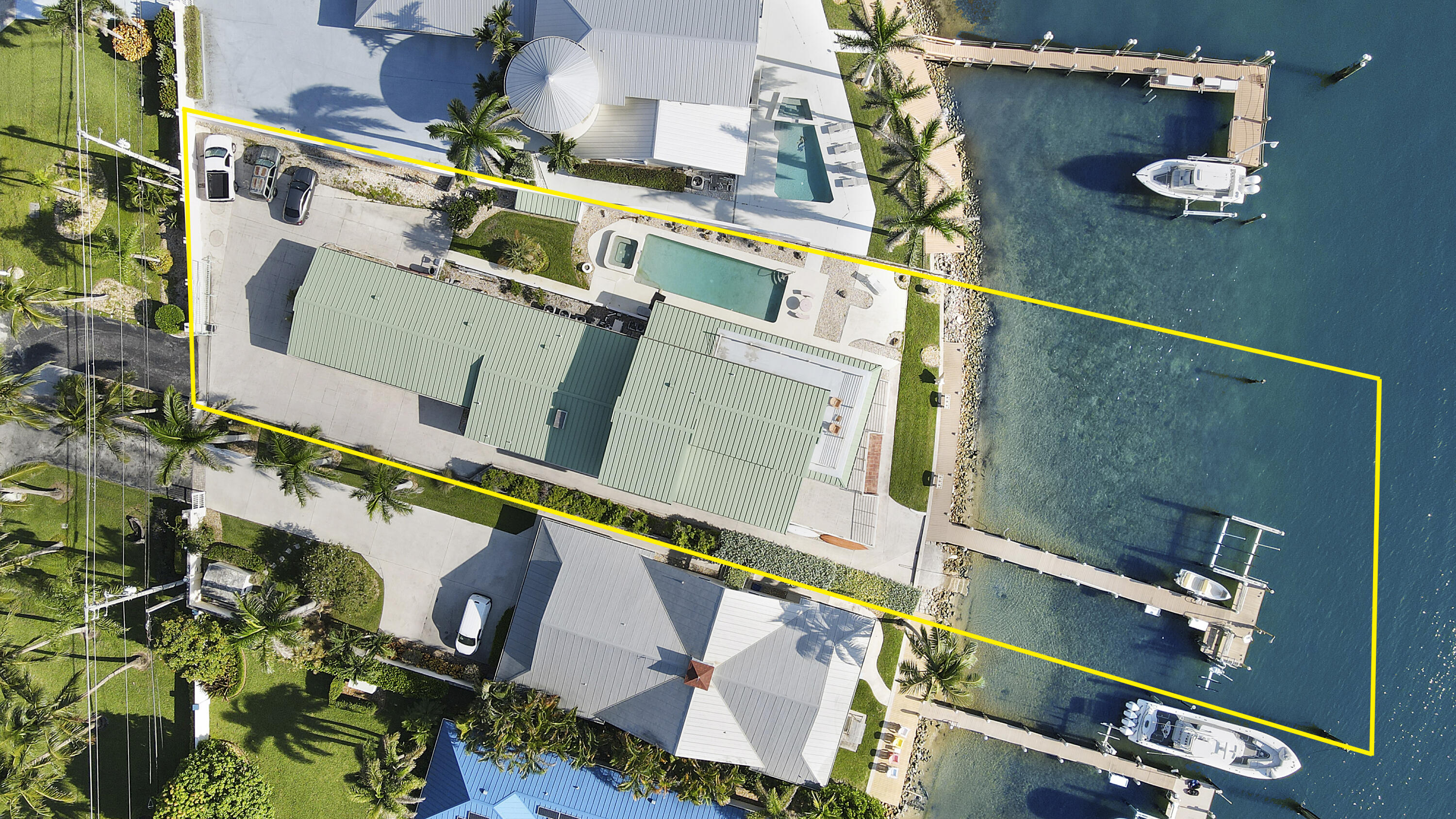 Discover unparalleled waterfront living in this remarkable home, featuring 5 spacious bedrooms, a den, and a separate office with its own entrance. Set against the backdrop of Jupiter Island and the serene Intracoastal Waterway, this property offers both stunning indoor and outdoor vistas.

Designed as a blank canvas, this residence presents an exceptional opportunity to personalize and make it your own. Enjoy breathtaking views from both the interior spaces and the expansive first and second-floor patios, perfect for capturing stunning sunsets and ideal for entertaining or relaxing. Featuring an impressive stretch of direct Intracoastal frontage and breathtaking views of the prestigious Jupiter Island, this property is a boater's dream, with a dock equipped with three lifts. The home also includes 4.2 bathrooms and a 4-car garage, providing ample space and comfort. The flexibility of residential or commercial zoning adds to its appeal, offering a range of exciting possibilities for future endeavors. Positioned conveniently near upscale shops and celebrated dining venues like Tiki 52 and Blue Pointe, this residence embodies the ultimate in waterfront luxury and versatility. Don't miss this unique chance to transform this exceptional space into your own personal paradise.