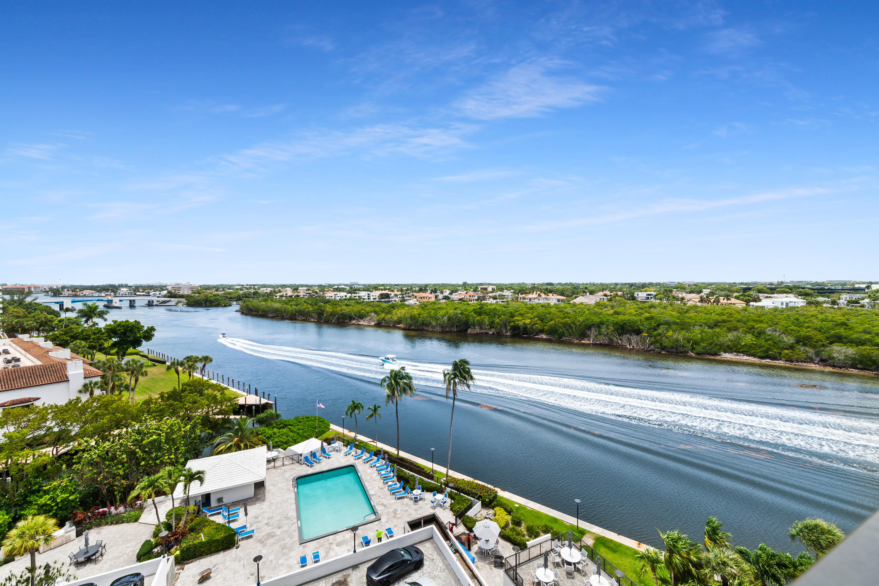 What a view! Discover this spacious 2 BR 2 BA apartment with DIRECT Intracoastal and partial ocean views. With ideal south west exposure, this 9th-floor residence offers sweeping vistas, spectacular sunrises, and blissful sunsets from your private balcony. Renovated approximately 6 years ago, it features an open-concept kitchen perfect for entertaining or watching yachts cruise by while preparing dinner. This community impresses from arrival with a tranquil waterfall entrance, Har-Tru tennis courts, and a newly renovated beach club with private pool and clubhouse. Need a break from the beach? Enjoy your private pool overlooking the Intracoastal, or step aboard your yacht from the private state-of-the-art marina—yacht not included, unfortunately.