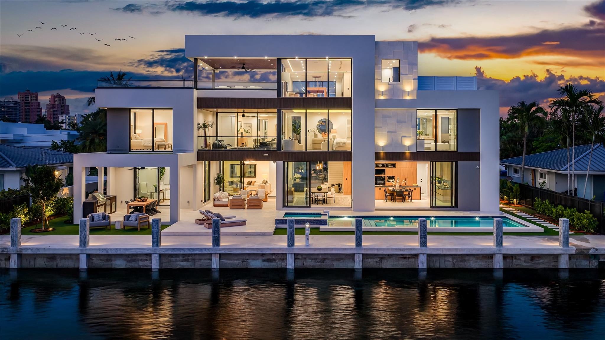New, Ultra-Modern Gated Deepwater Estate on 100’ of waterfront in Coral Ridge Estates, designed by architect Bruce Celenski, developed by Feldman Development and built by Garza Contractors. This stunning new construction spans 8,286+/- total square feet, featuring five bedrooms, seven full baths, and one half-bath. Highlights include a private office, custom movie theater room, gourmet chef’s kitchen with premium appliances, elevator, and an expansive third-floor club room with panoramic views. Outdoor amenities offer a resort-style pool with spillover spa, a covered pavilion, and a fully outfitted summer kitchen for effortless entertaining. Ideal for boating enthusiasts, the property includes a brand-new full service concrete yacht dock, providing easy ocean access with no fixed bridges. 2849 NE 29th Street., Fort Lauderdale, Florida: Offering an unparalleled fusion of relaxed coastal living and access to vibrant South Florida amenities, Coral Ridge presents an idyllic sanctuary for those seeking the epitome of refinement. Residents enjoy a plethora of cultural delights just beyond their doorstep. For nature enthusiasts, the nearby Hugh Taylor Birch State Park beckons with its lush landscapes and serene trails, while pristine beaches offer a haven of tranquility and relaxation.                                  PROPERTY:A contemporary marvel with a sun-splashed textural stone-clad façade set off by lustrous wood trim, the gated motor court welcomes, while in the back, with 100 feet on a deep canal off the Intracoastal Waterway and a full-service concrete yacht dock, the covered loggia and fully equipped summer-kitchen pavilion overlook the resort-style heated pool with an overflow spa and sun shelf. Enhancing indoor/outdoor living, the second-floor primary suite opens to a water-view loggia and the VIP suite flows out to a large water-view roof-top sundeck, while on the third-floor, the entertaining loggia unfolds onto an expansive water-view terrace.RESIDENCE:The ultimate in luxury on the waterfront, this brand-new ultra-modern masterpiece — designed by Bruce Celenski with interiors appointed by M. Borges Design — is as functional as it is beautiful. Offering contemporary elegance, a refined aesthetic, and effortless livability, this five-bedroom, seven-and-half-bath residence, spanning 8,286± total square feet, showcases architectural brilliance through an elegant material palette, curated finishes, expert craftsmanship, and meticulous attention to detail. Introduced by a sensational two-story foyer with a glass-railed floating stairway, all major rooms unfold in a free-flowing layout with window walls of sliding glass doors framing pool and water views. Plush and polished, the chic living room, topped by a tray ceiling, flows out to the pool terrace. The dining area connects to the chef’s kitchen, anchored by a T-shaped island and appointed with sleek Savanah-walnut cabinetry, Silestone Eternal Noir counters and backsplashes, wet bar, and professional grade appliances. The office overlooks the dining pavilion, while the theater room expands the residence’s leisure amenities. Just off the foyer, a guest suite is ideal for visiting family and guests. Upstairs, the central lounge connects a water-view guest bedroom suite, two garden-view guest bedroom suites and the primary bedroom suite. A serene retreat, the primary suite, spanning one side of the second-floor layout, comprises a master bedroom that opens to a water-view balcony, two generous walk-in closets and a luxurious spa-like bathroom with a freestanding tub, walk-in shower, dual vanities, linen closet and separate water closet. On the third floor, the club room with a bar opens to an expansive loggia and rooftop deck, creating the residence’s ultimate social hub. Exceeding expectations at every turn, this residence unites bold architecture and visionary design in perfect harmony. DISCLAIMER: Information published or otherwise provided by the listing company and its representatives including but not limited to prices, measurements, square footages, lot sizes, calculations, statistics, and videos are deemed reliable but are not guaranteed and are subject to errors, omissions or changes without notice. All such information should be independently verified by any prospective purchaser or seller. Parties should perform their own due diligence to verify such information prior to a sale or listing. Listing company expressly disclaims any warranty or representation regarding such information. Prices published are either list price, sold price, and/or last asking price. The listing company participates in the Multiple Listing Service and IDX. The properties published as listed and sold are not necessarily exclusive to listing company and may be listed or have sold with other members of the Multiple Listing Service. Transactions where listing company represented both buyers and sellers are calculated as two sales. “No payments made until title passes” Some affiliations may not be applicable to certain geographic areas. If your property is currently listed with another broker, please disregard any solicitation for services. Information published or otherwise provided by seller, listing company or its representatives is deemed reliable but are not guaranteed and subject to errors, omissions, or changes without notice. Copyright 2025 by the listing company. All Rights Reserved.DISCLAIMER: Information published or otherwise provided by the listing company and its representatives including but not limited to prices, measurements, square footages, lot sizes, calculations, statistics, and videos are deemed reliable but are not guaranteed and are subject to errors, omissions or changes without notice. All such information should be independently verified by any prospective purchaser or seller. Parties should perform their own due diligence to verify such information prior to a sale or listing. Listing company expressly disclaims any warranty or representation regarding such information. Prices published are either list price, sold price, and/or last asking price. The listing company participates in the Multiple Listing Service and IDX. The properties published as listed and sold are not necessarily exclusive to listing company and may be listed or have sold with other members of the Multiple Listing Service. Transactions where listing company represented both buyers and sellers are calculated as two sales. “No payments made until title passes” Some affiliations may not be applicable to certain geographic areas. If your property is currently listed with another broker, please disregard any solicitation for services. Information published or otherwise provided by seller, listing company or its representatives is deemed reliable but are not guaranteed and subject to errors, omissions, or changes without notice. Copyright 2025 by the listing company. All Rights Reserved.