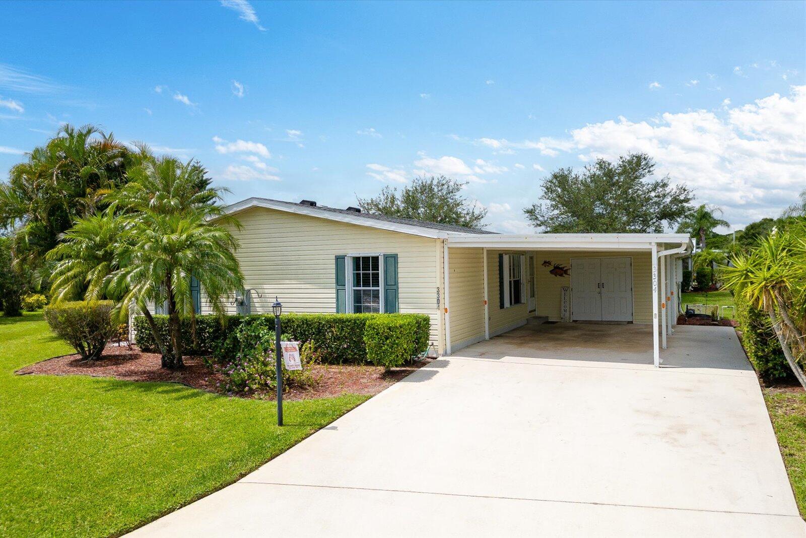 RECENT PRICE REDUCTION!!  Rare & unique find here in the desirable Savanna Club!  Quaint corner location with privacy amongst preserves.  Your lanai will not disappoint these views!  This 2 bedroom, 2 bathroom with a den home offers a 2021 roof & AC, a 2024 HWH accordion shutters & newer appliances comes turnkey!  Home is on LEASED LAND. All measurements are approximate, buyer(s) to verify.