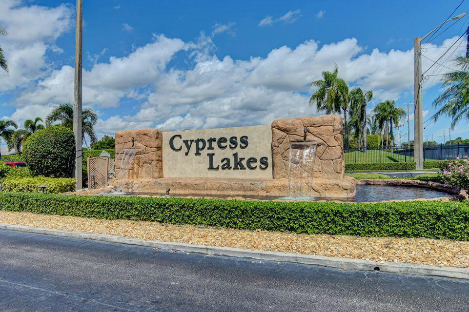 Welcome to this guard-gated, amenity-rich community of Cypress Lakes in West Palm Beach. This inviting 2 bed, 2 bath villa has been totally renovated, offering a seamless blend of modern comfort and carefree living.  Step into an open-concept living and dining space that flows effortlessly into a beautifully updated kitchen featuring sleek cabinetry, quartz countertops, stainless steel appliances, and stylish fixtures. Both bathrooms have been tastefully transformed, and the bedrooms are spacious and bright — including a master suite with its own full bath for added convenience.  A screened patio (or covered lanai) extends your living outdoors where you can enjoy morning coffee or evening relaxation overlooking lush landscaping or tranquil community views. Within Cypress Lakes you'll enjoy resort-style amenities: a 9-hole golf course (no membership required), clubhouse with pool and spa, fitness centre, tennis/pickle-ball courts, shuffleboard, bocce, and more   all within a vibrant, 55+ lifestyle community.  Ideally located just minutes from I-95, The Florida Turnpike, shopping, dining, International Airport and Palm Beach's white-sand beaches, this villa offers the perfect combination of lifestyle, location, and low-maintenance living.  Don't miss your opportunity to own a beautifully updated home in Cypress Lakes   move-in ready and waiting for you!
